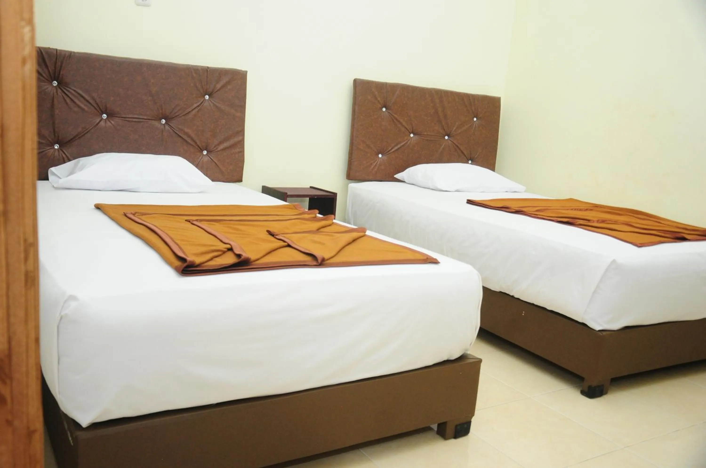 Bed in Dena Hotel