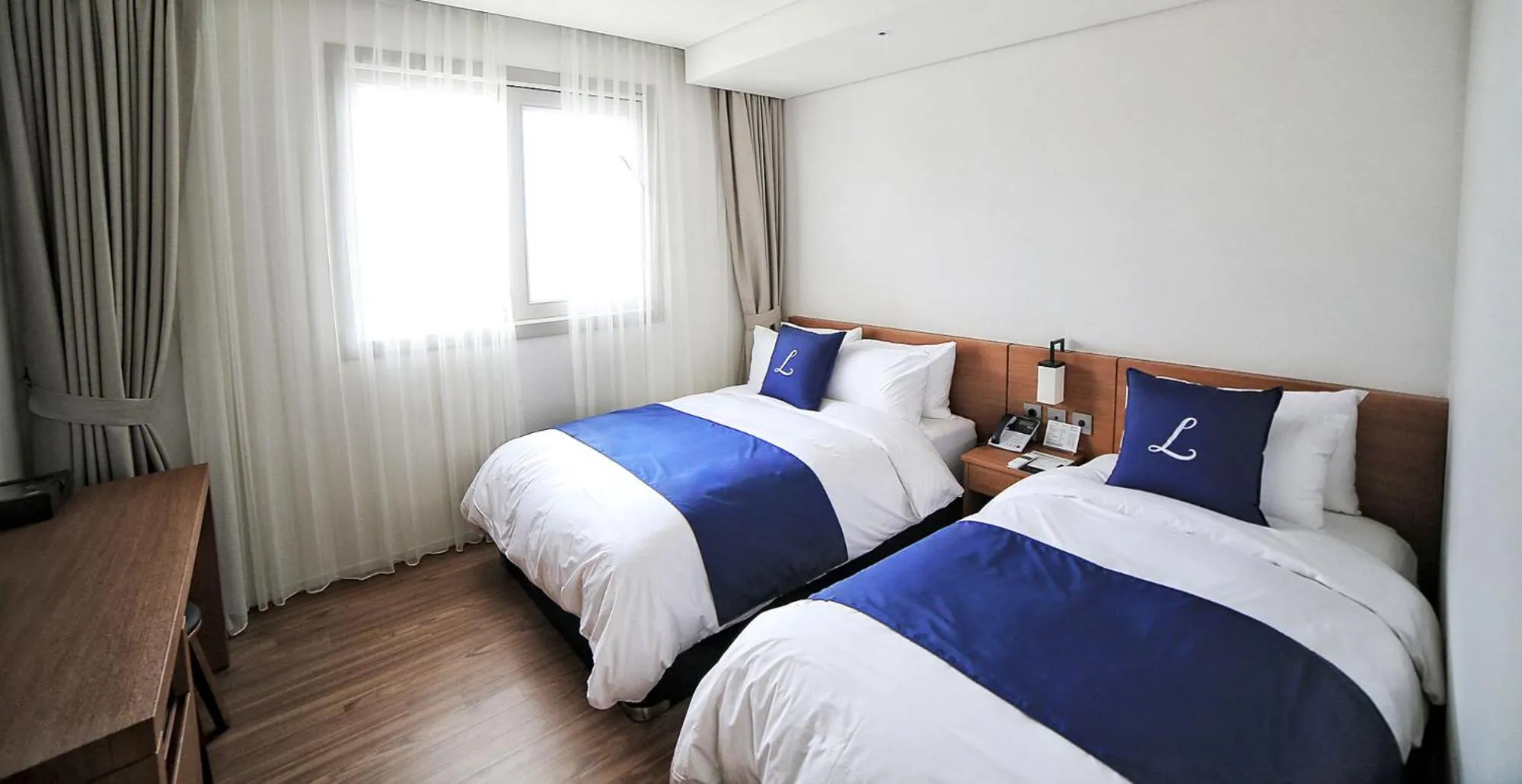 Seating area, Bed in Lapis Hotel Namhae