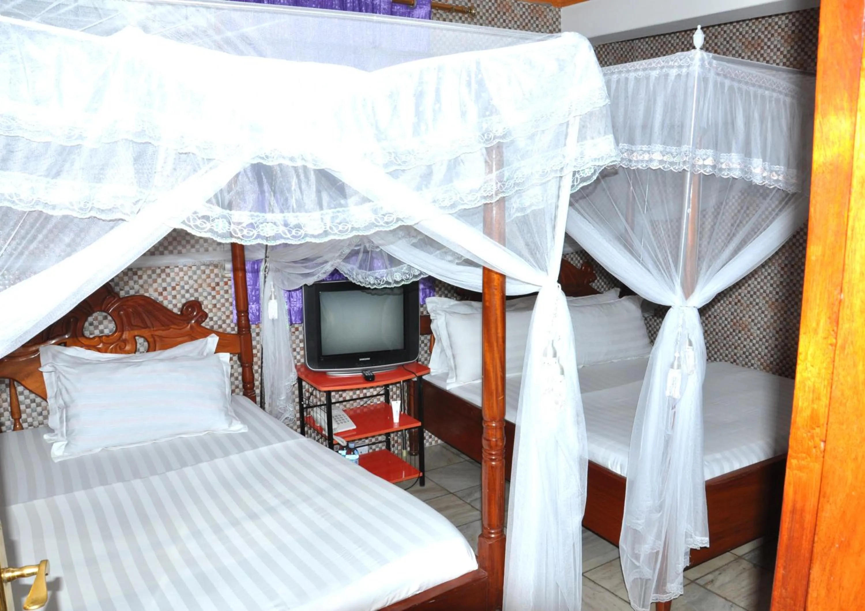 Bed in Sandton Hotel Kasese