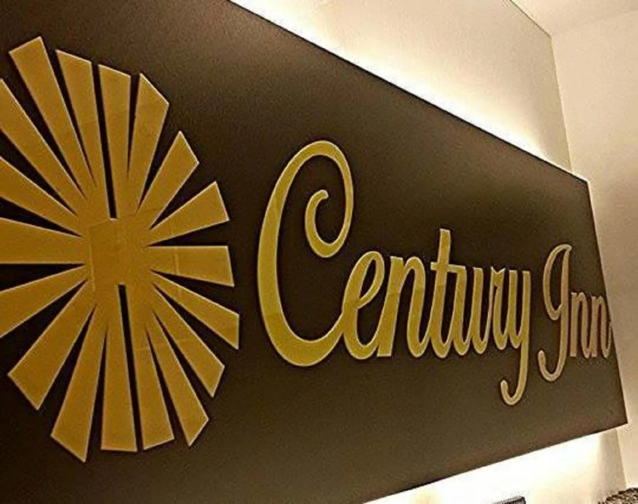 Property logo or sign in Century Inn Hotel