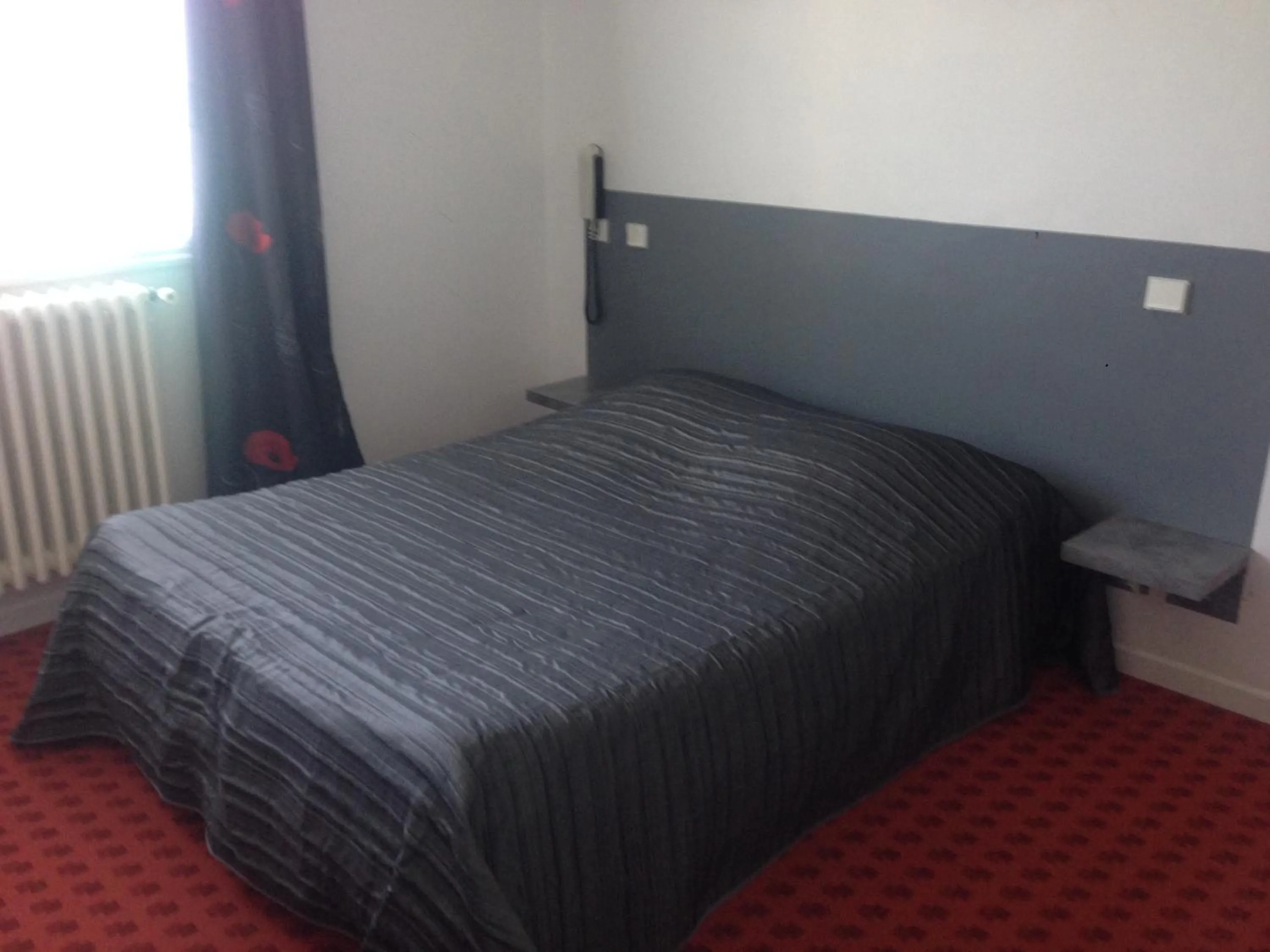 Bed in Hotel De La Poste