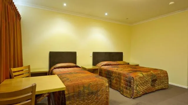 Bed in Motel Le Grande