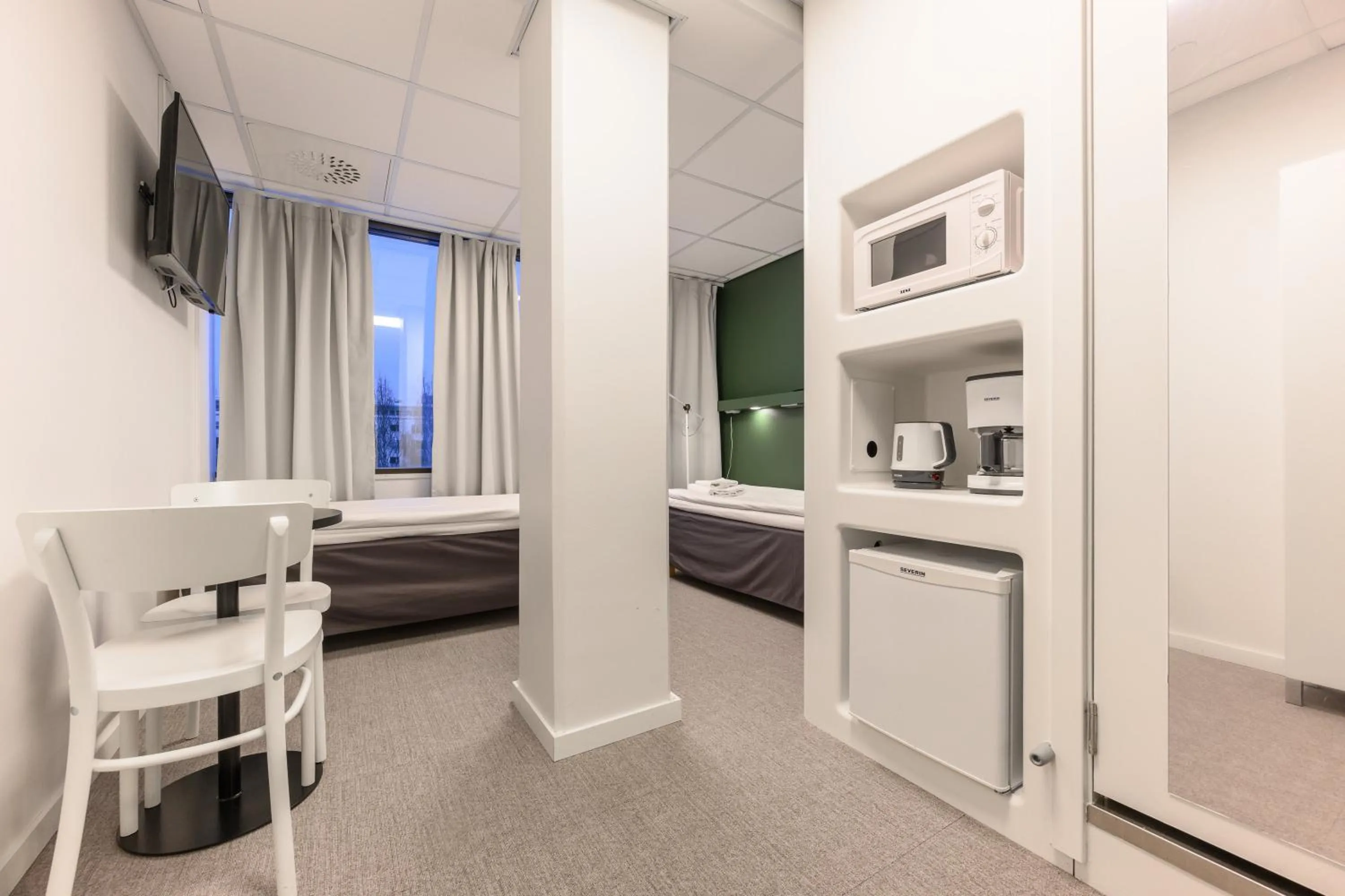 TV and multimedia, Bed in GreenStar Hotel Oulu