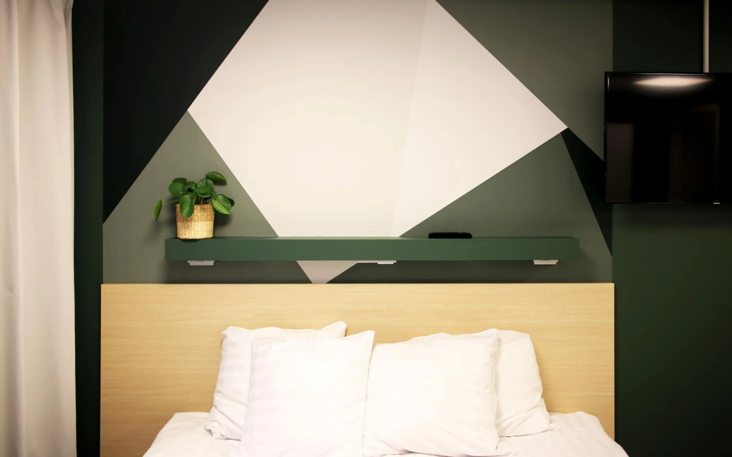 Decorative detail, Bed in GreenStar Hotel Oulu