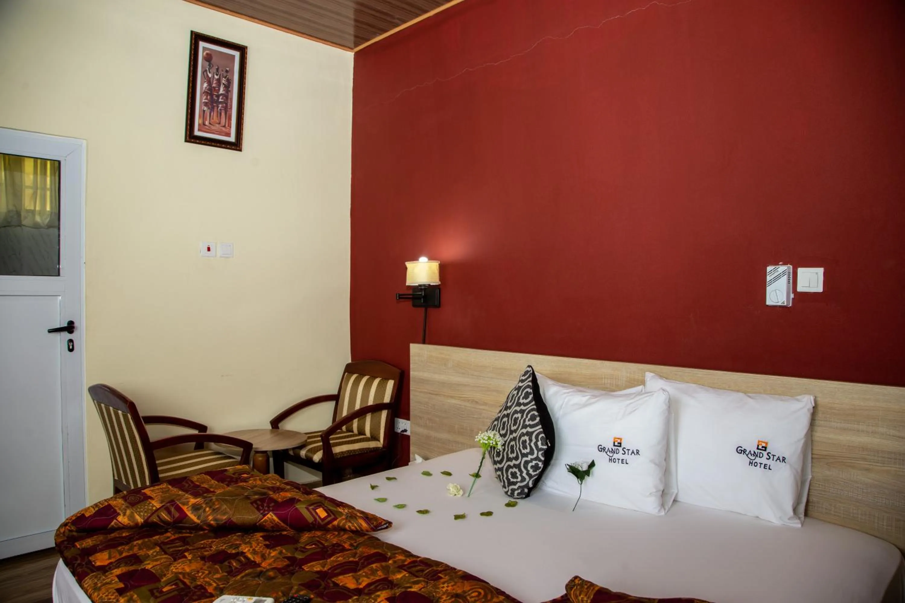 Living room, Bed in Grand Star Hotel