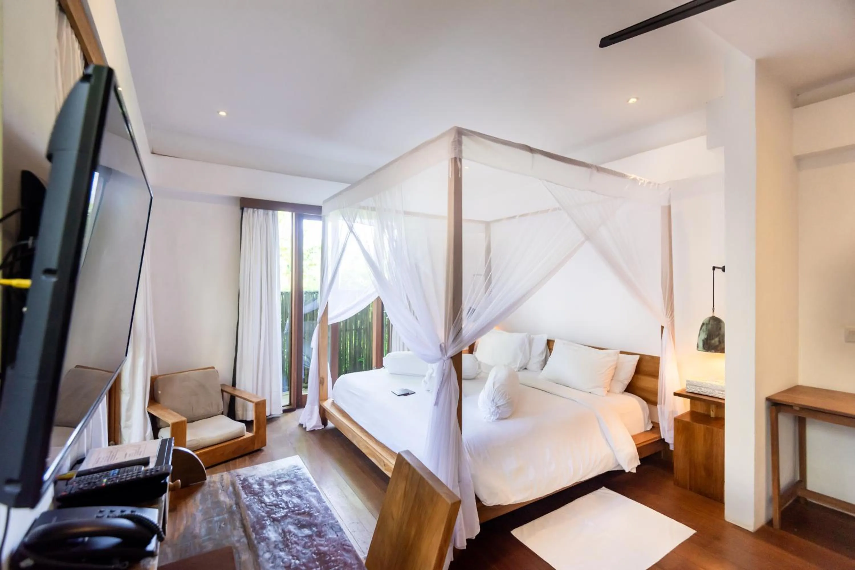 Bed in De Ubud Villas & Spa