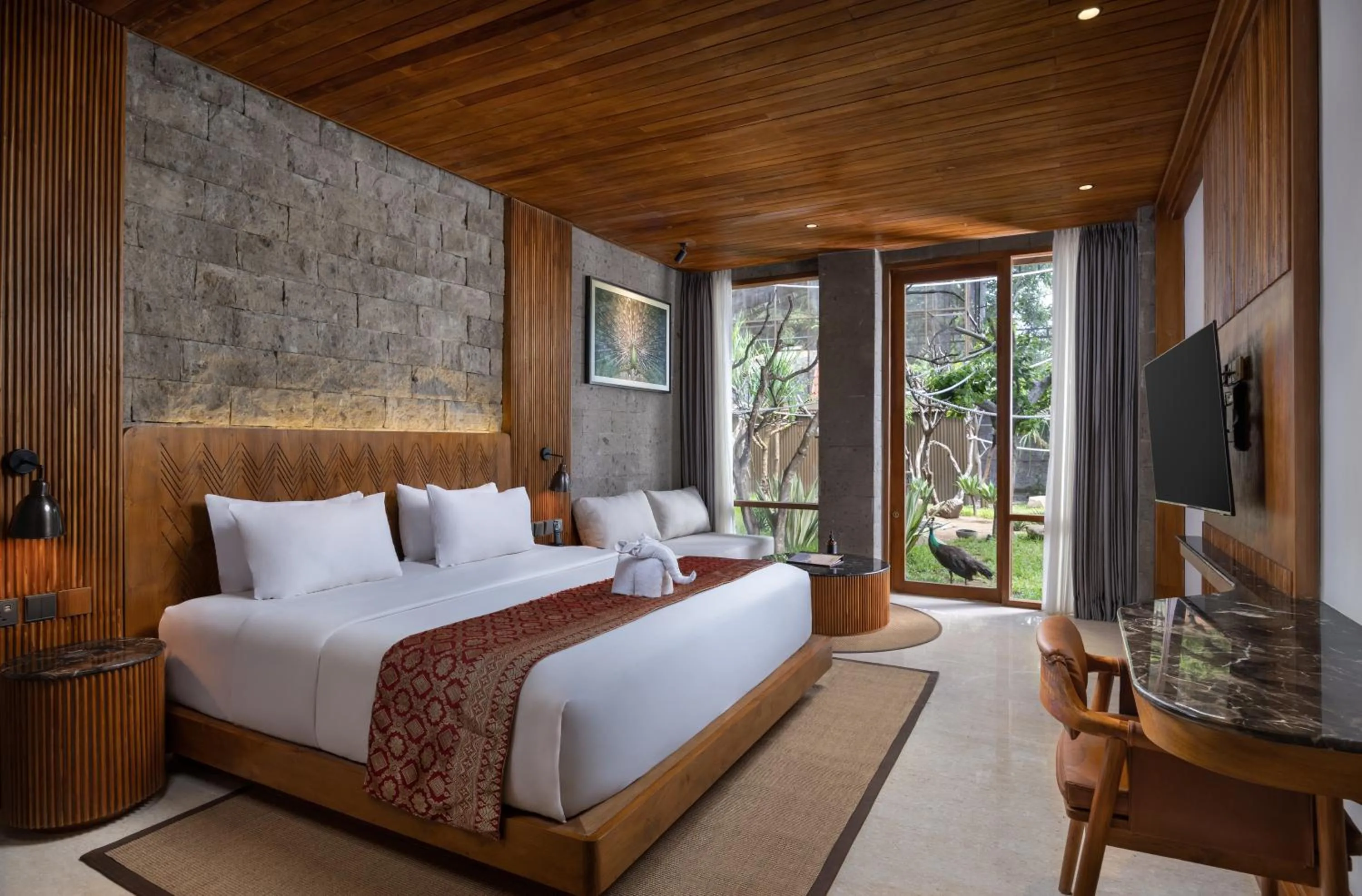 Bed in Sanctoo Suites & Villas