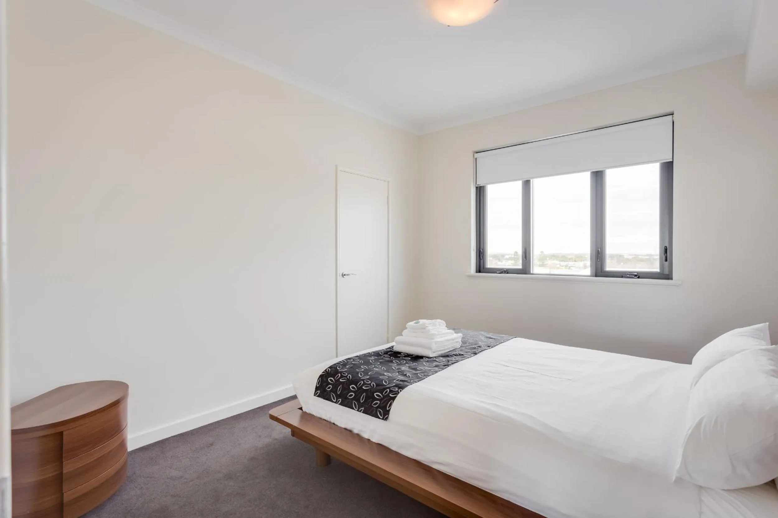 Day, Bed in Nautilus by Rockingham Apartments