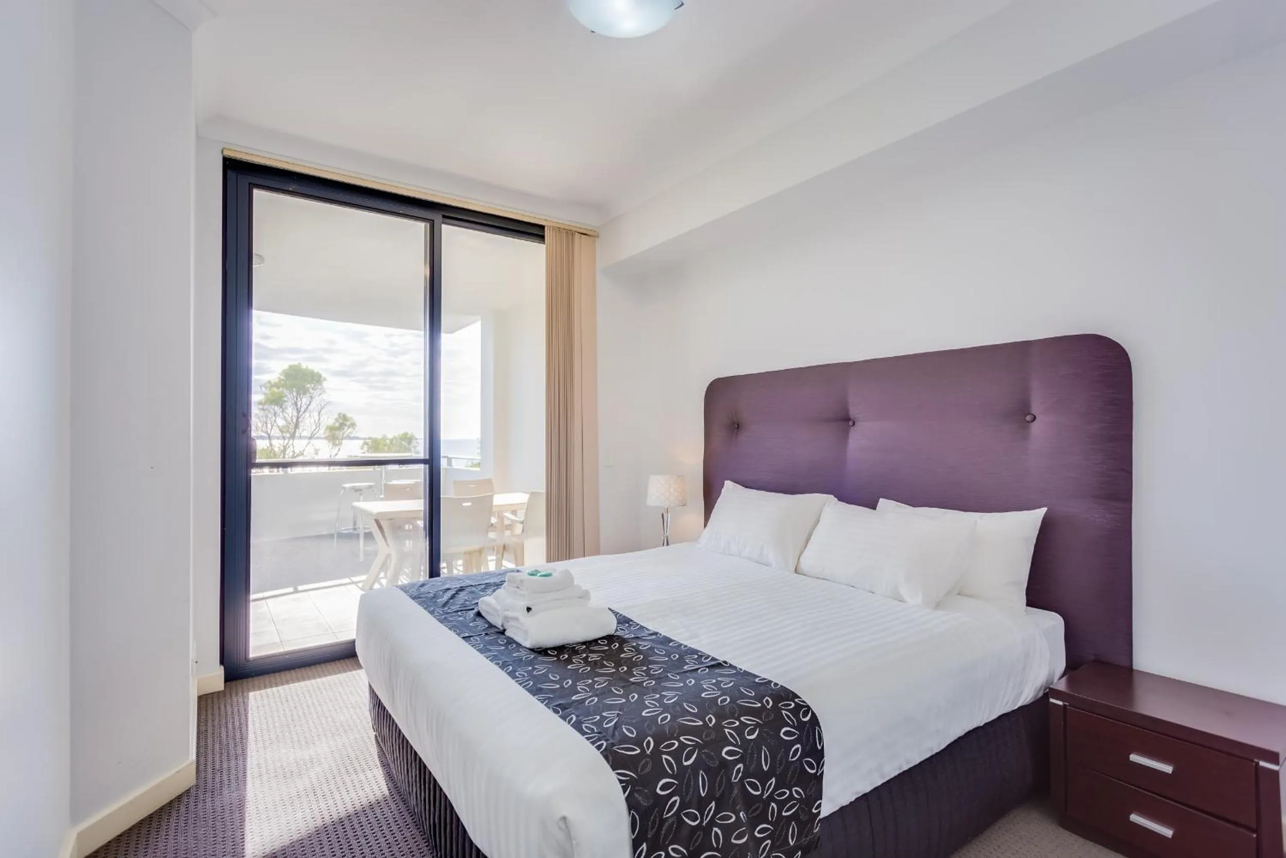 Day, Bed in Nautilus by Rockingham Apartments
