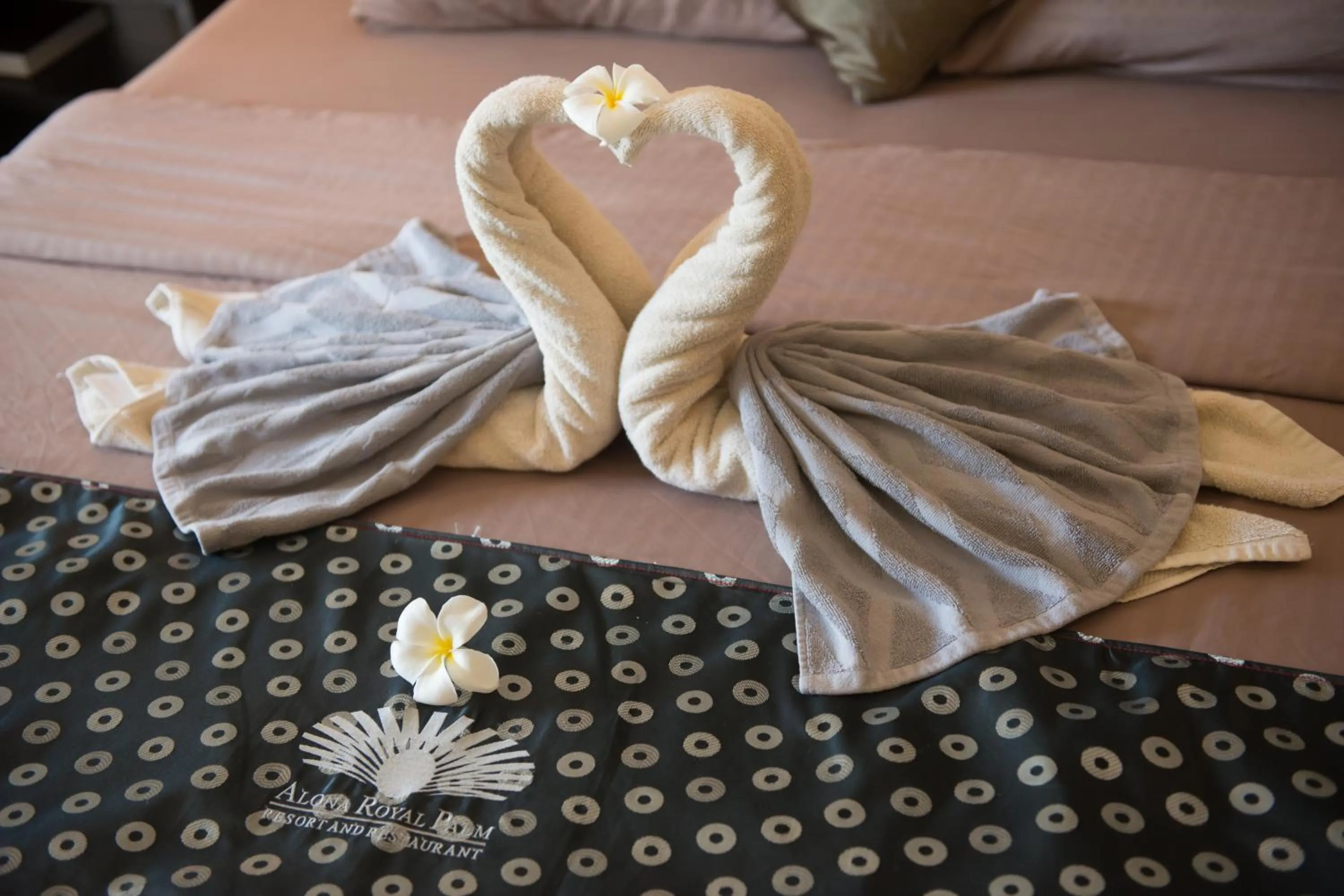 Bed in Alona Royal Palm Resort