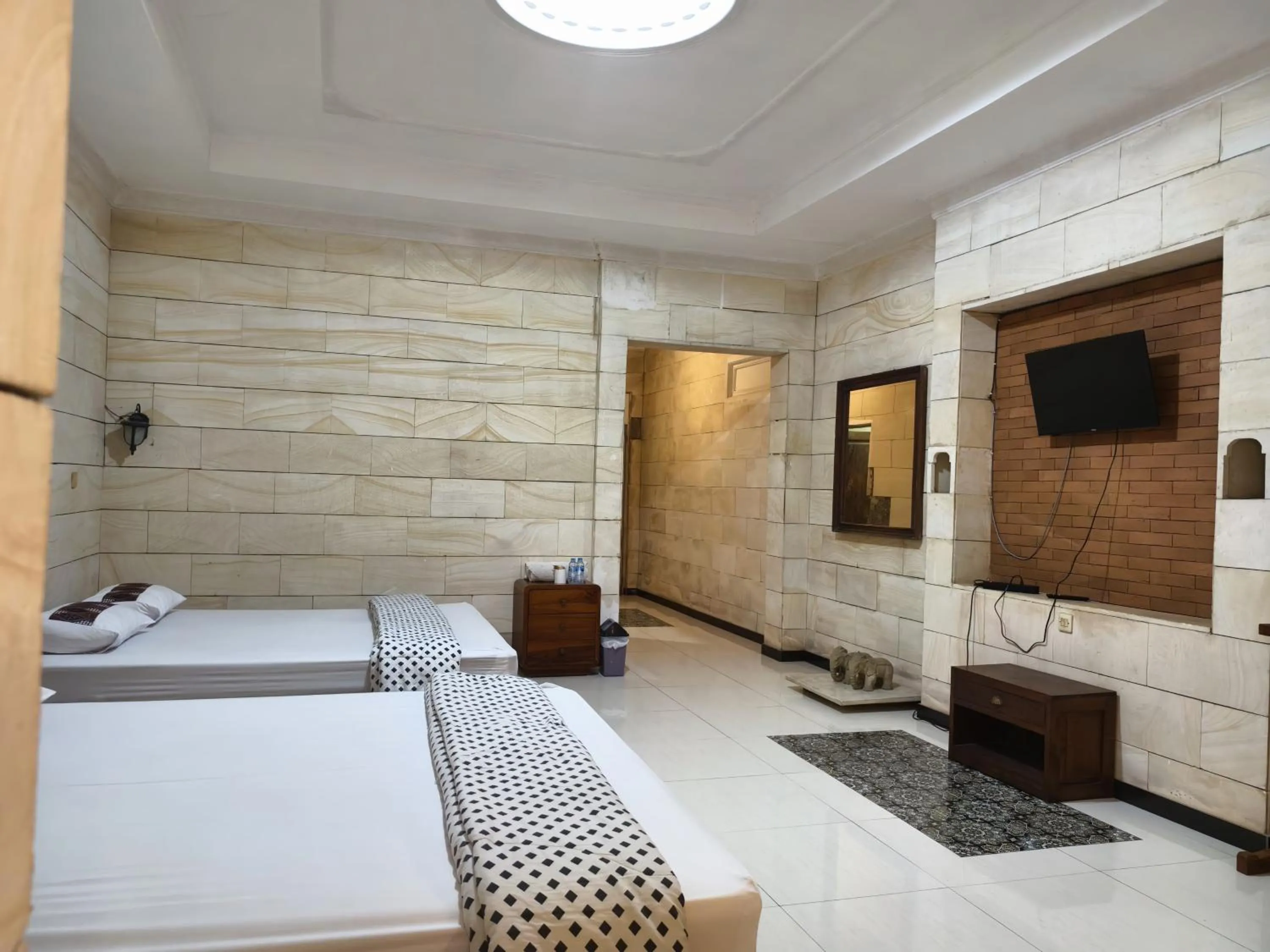 Bed in Lotus 2 Guest House