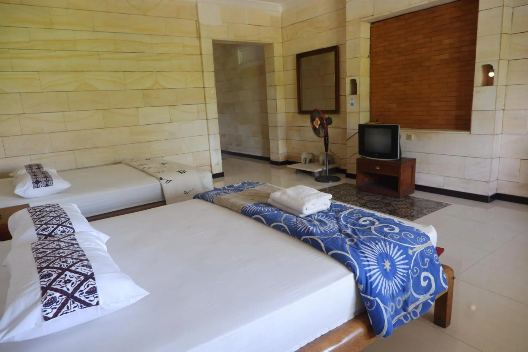 Bed in Lotus 2 Guest House