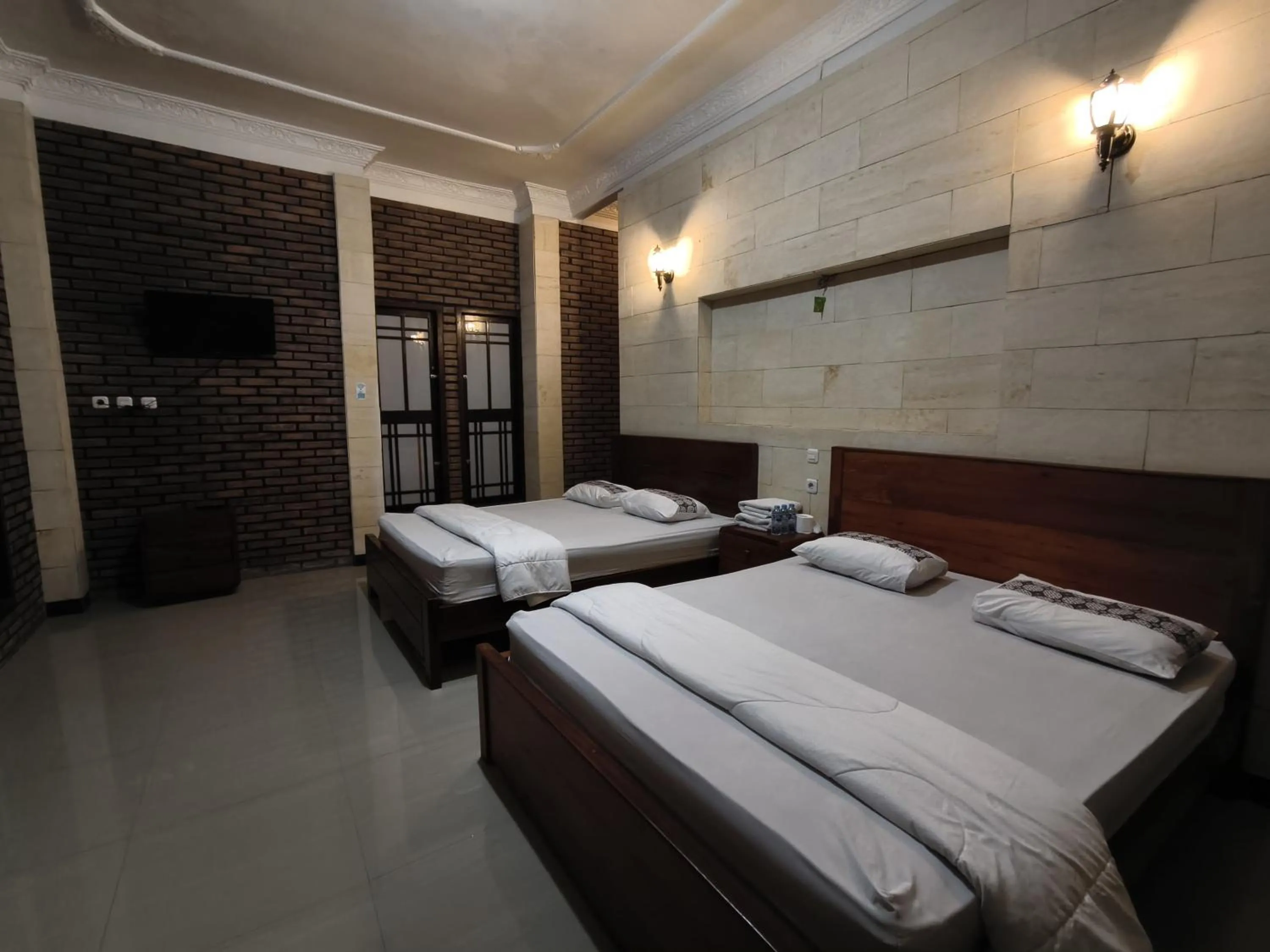 Bed in Lotus 2 Guest House