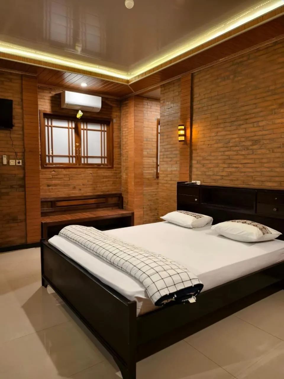 Bed in Lotus 2 Guest House