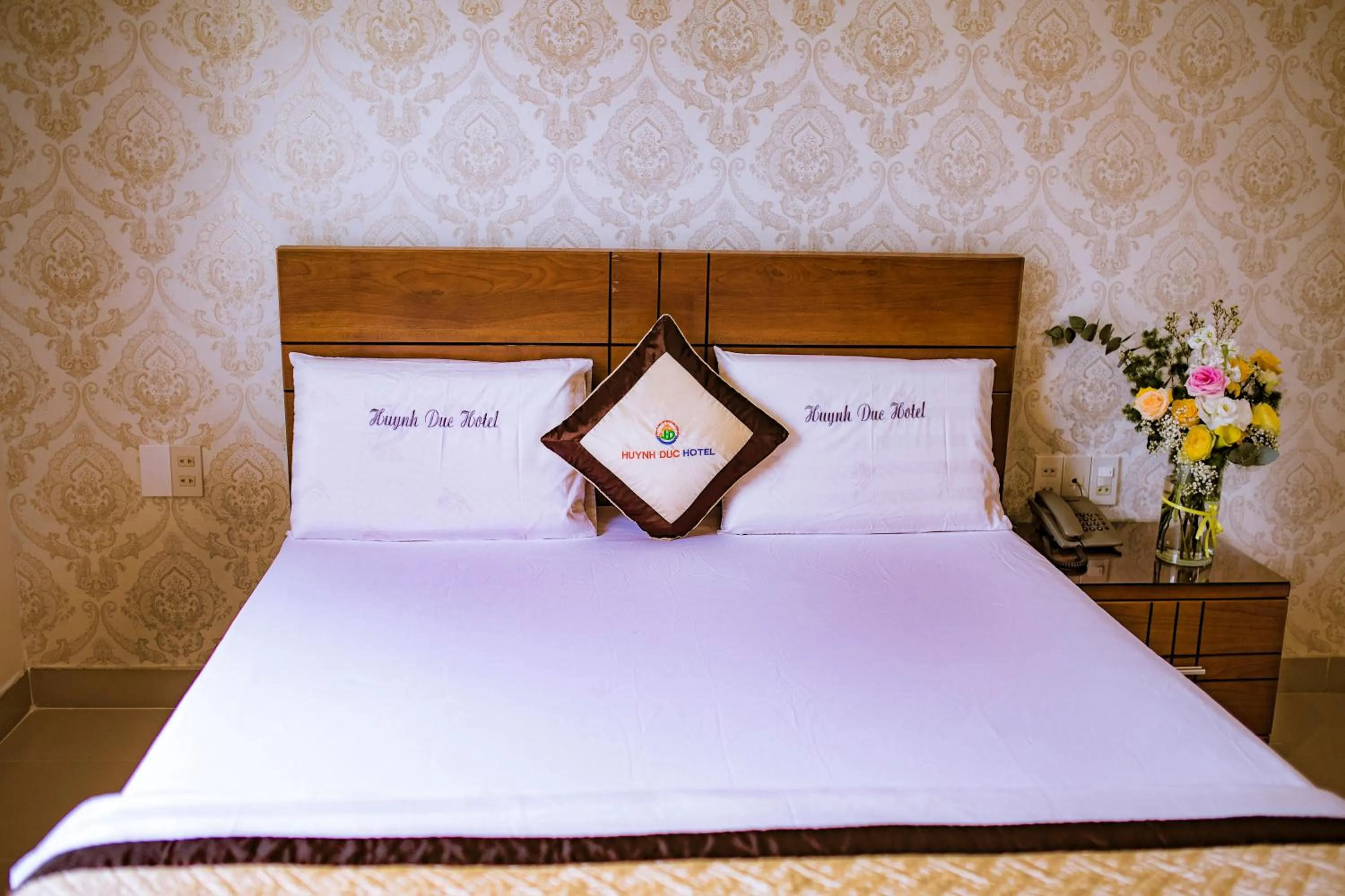 Bed in Huynh Duc Hotel