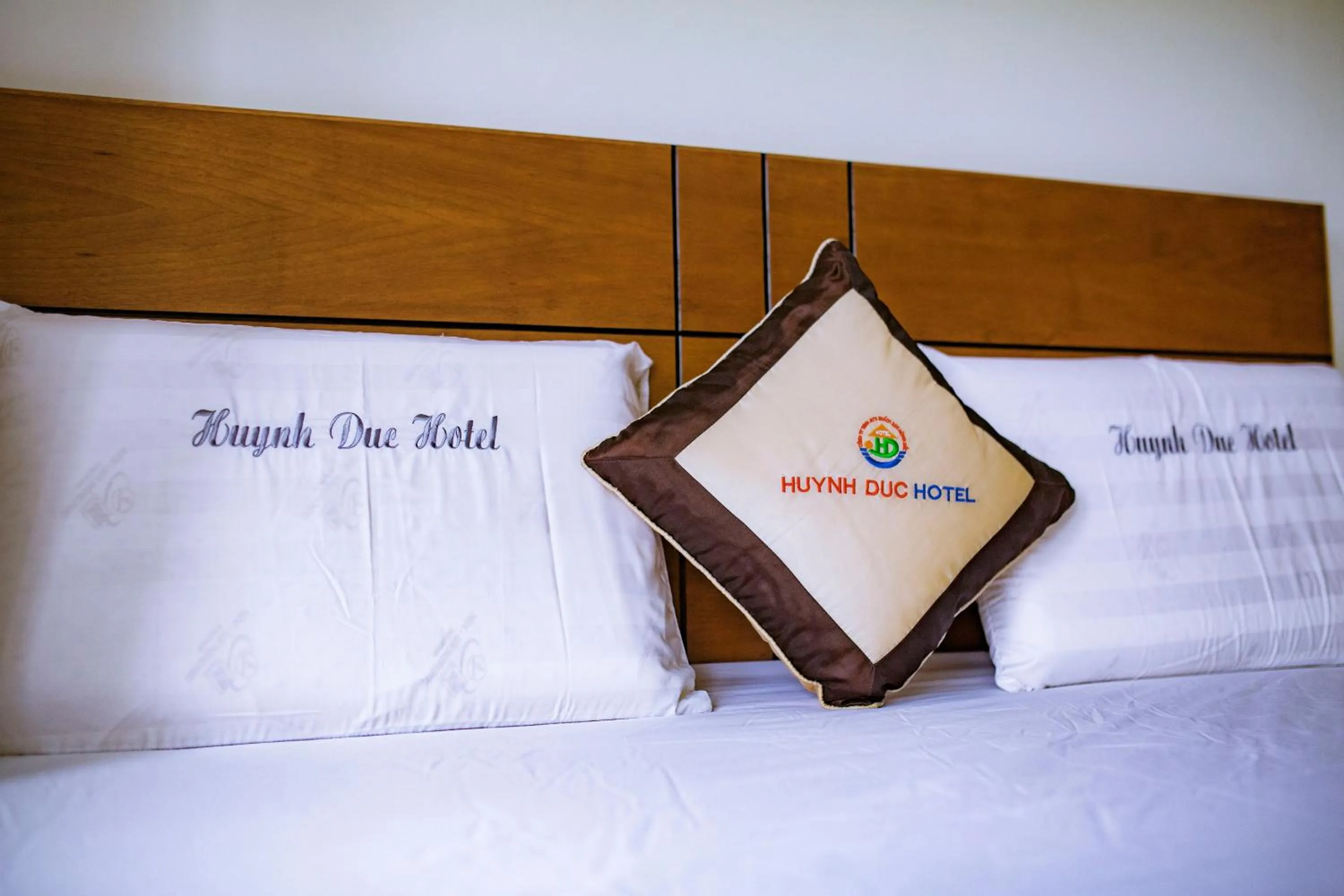 Bed in Huynh Duc Hotel