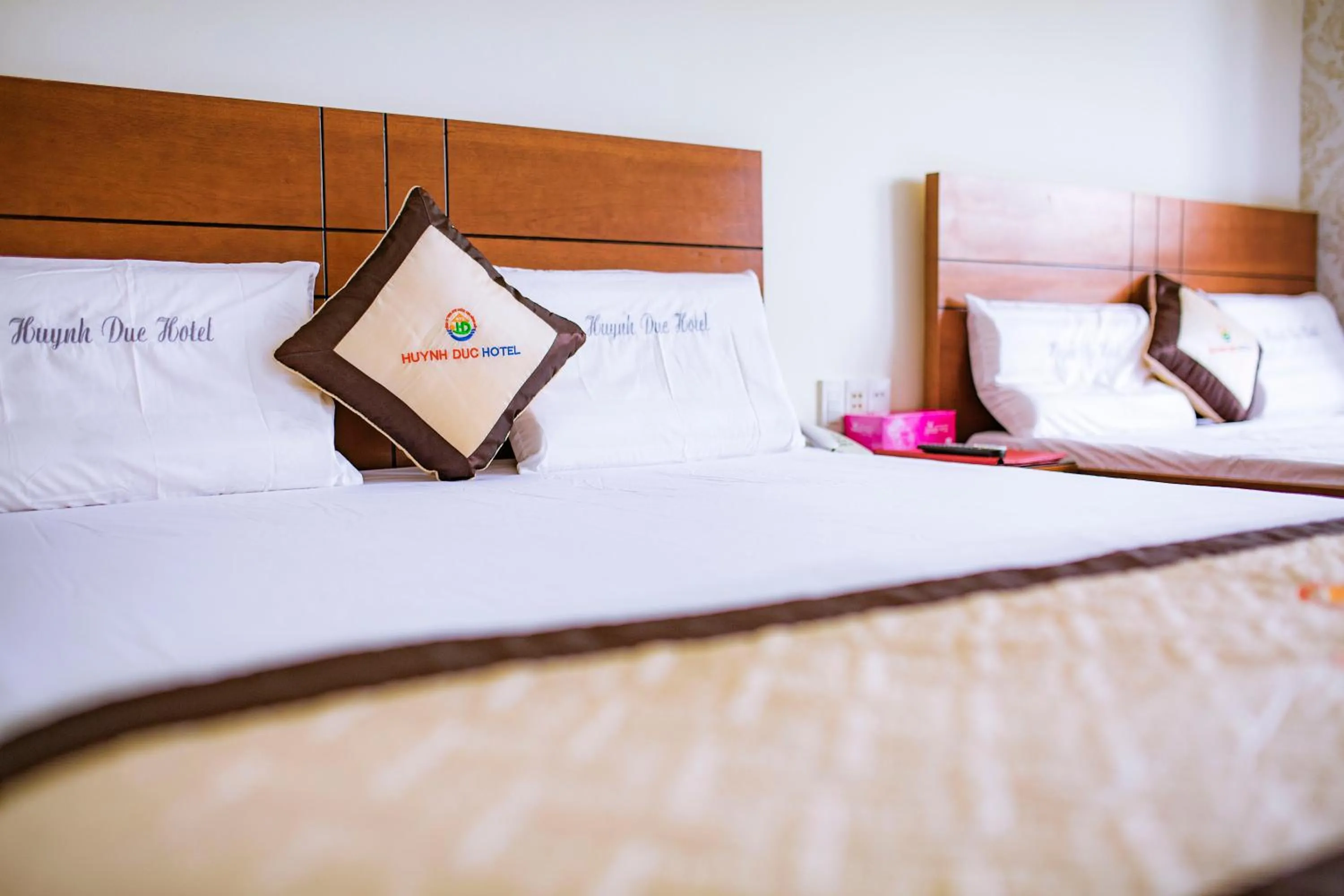 Bed in Huynh Duc Hotel