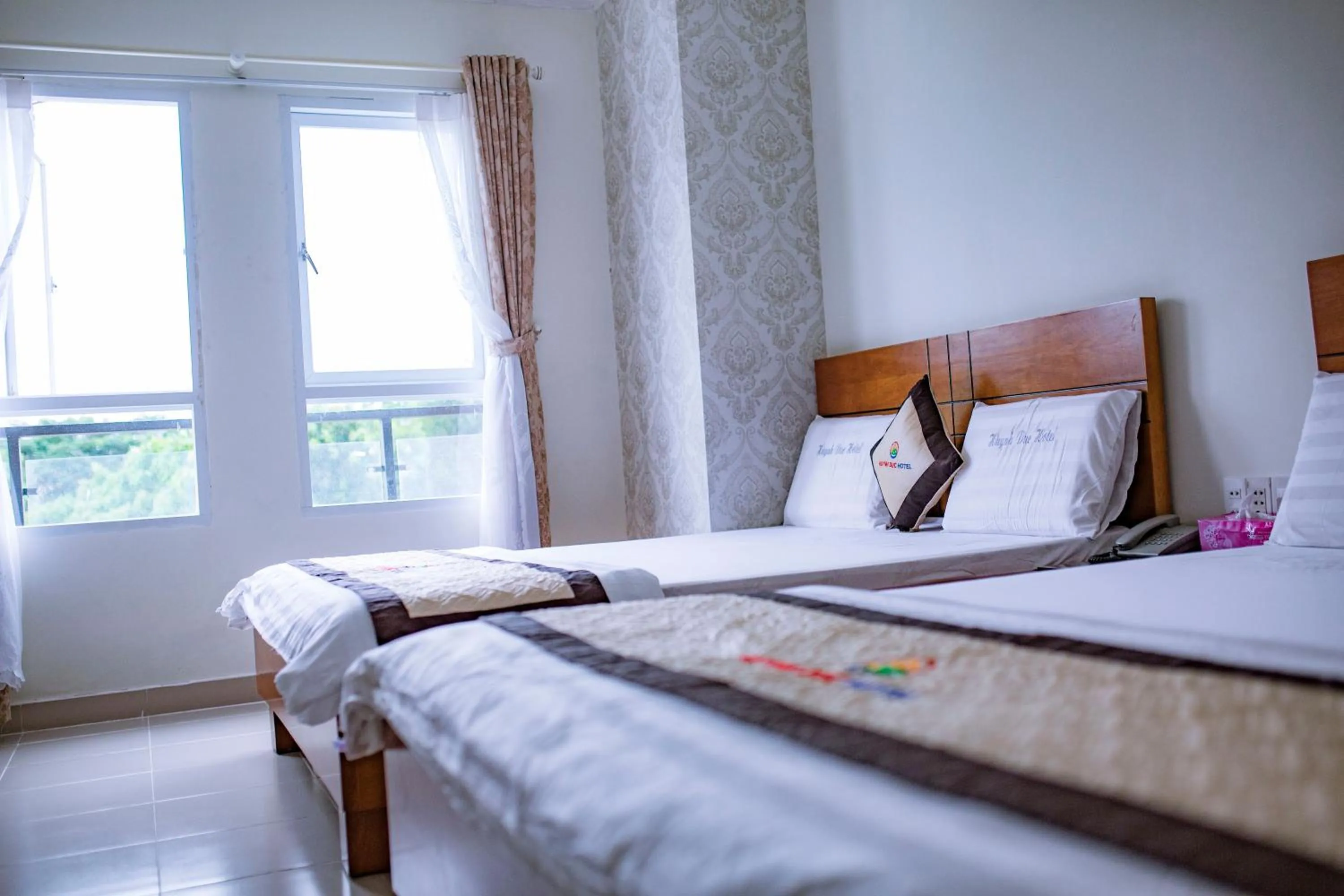 Bed in Huynh Duc Hotel