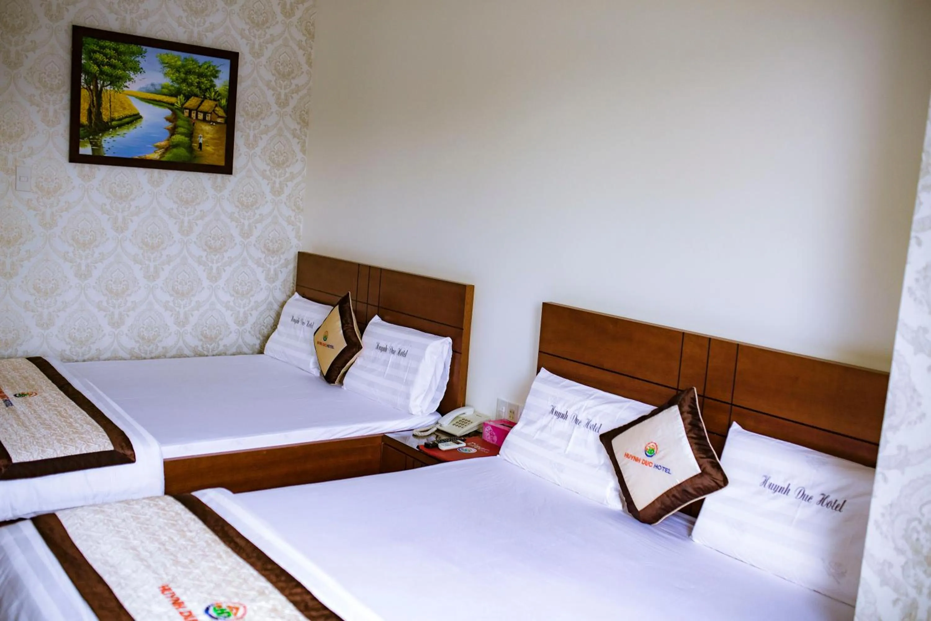 Bed in Huynh Duc Hotel