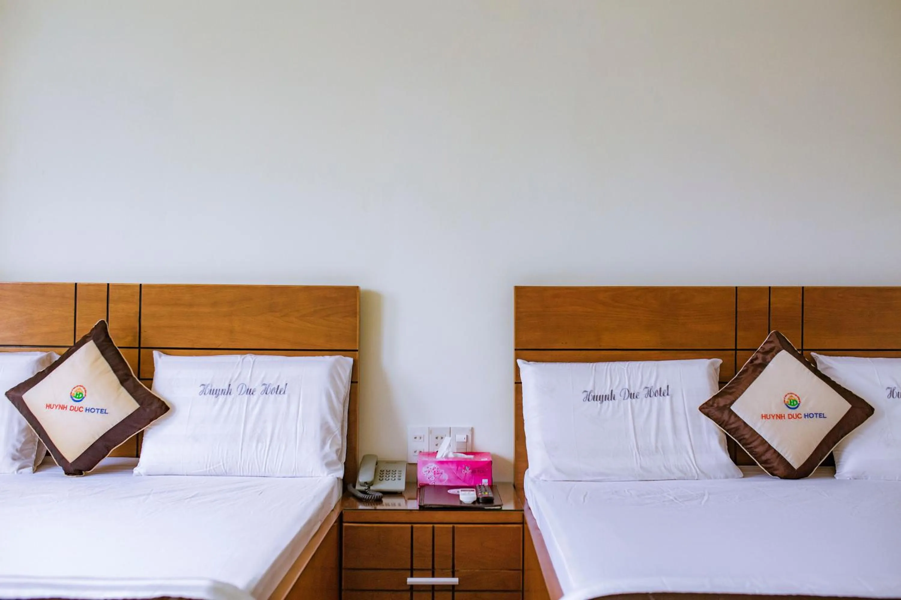 Bed in Huynh Duc Hotel