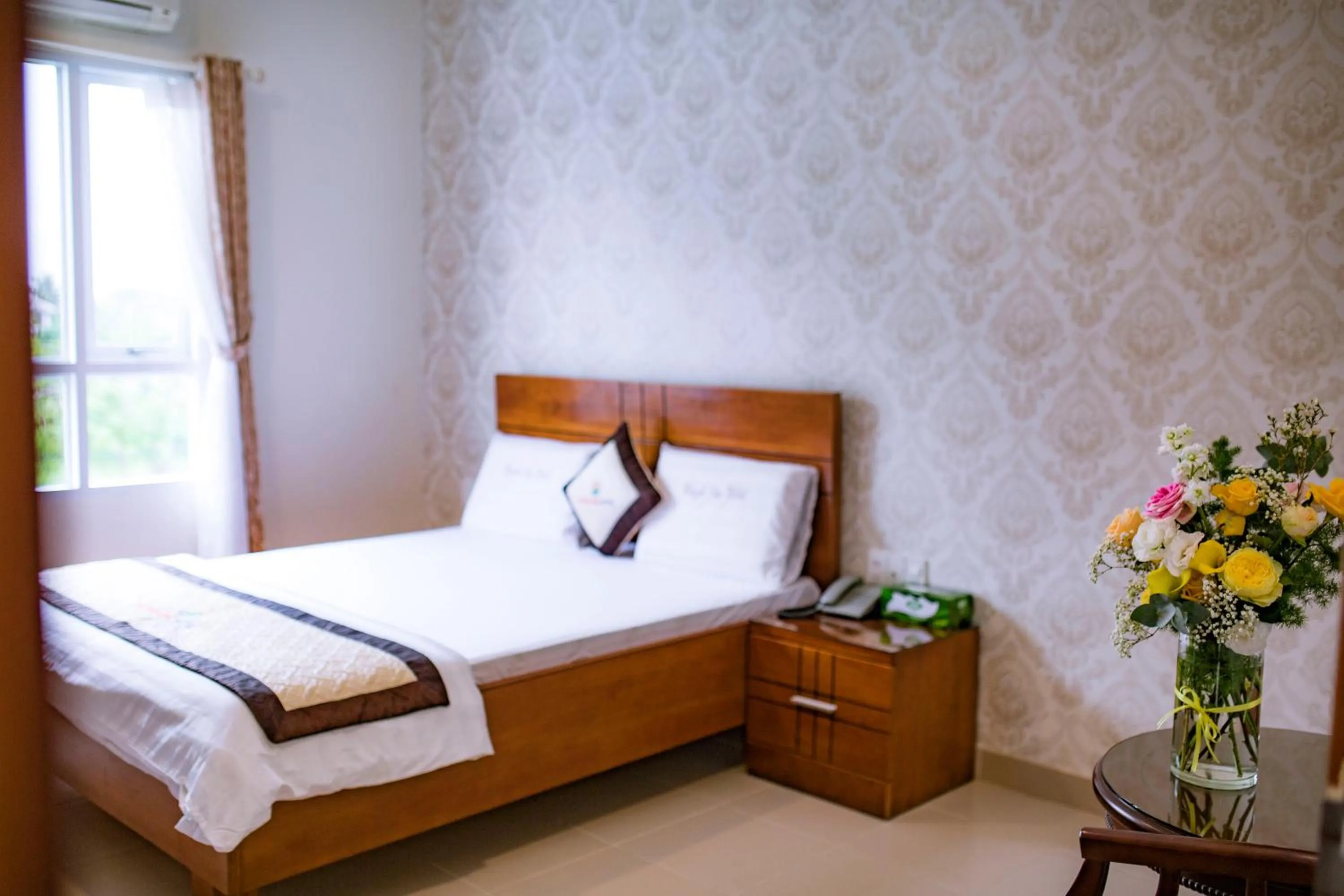 Bed in Huynh Duc Hotel