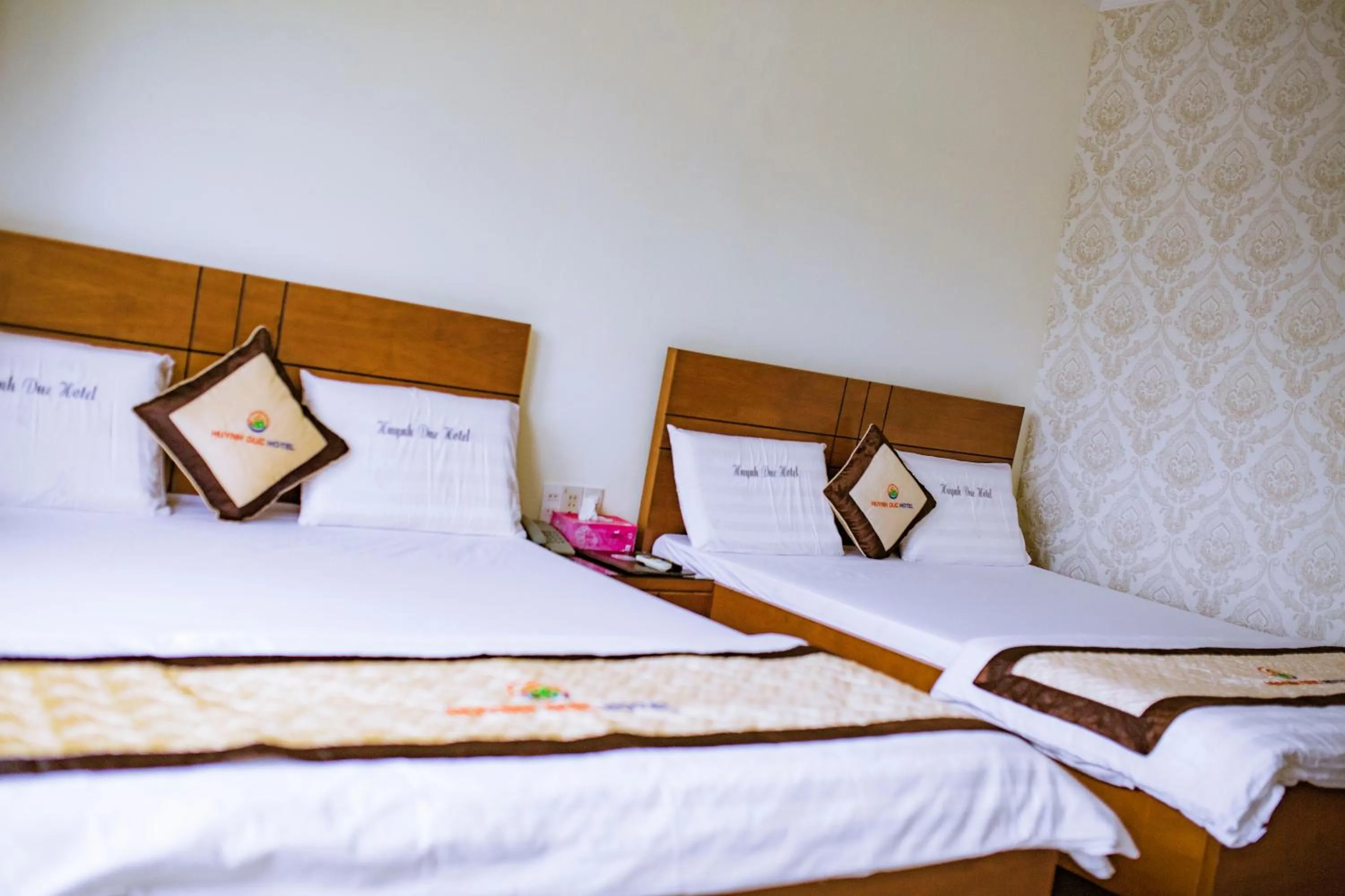 Bed in Huynh Duc Hotel