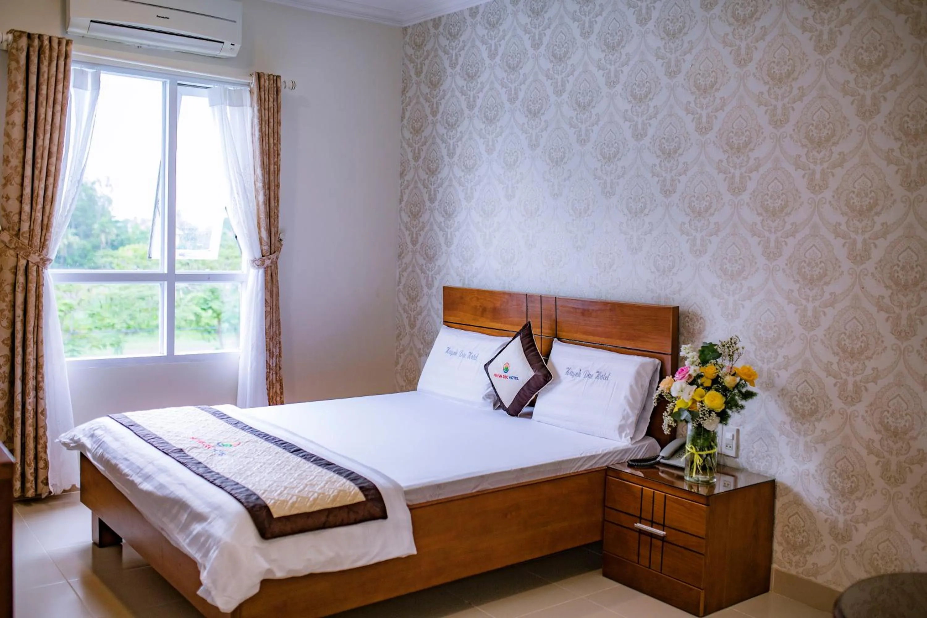 Bed in Huynh Duc Hotel