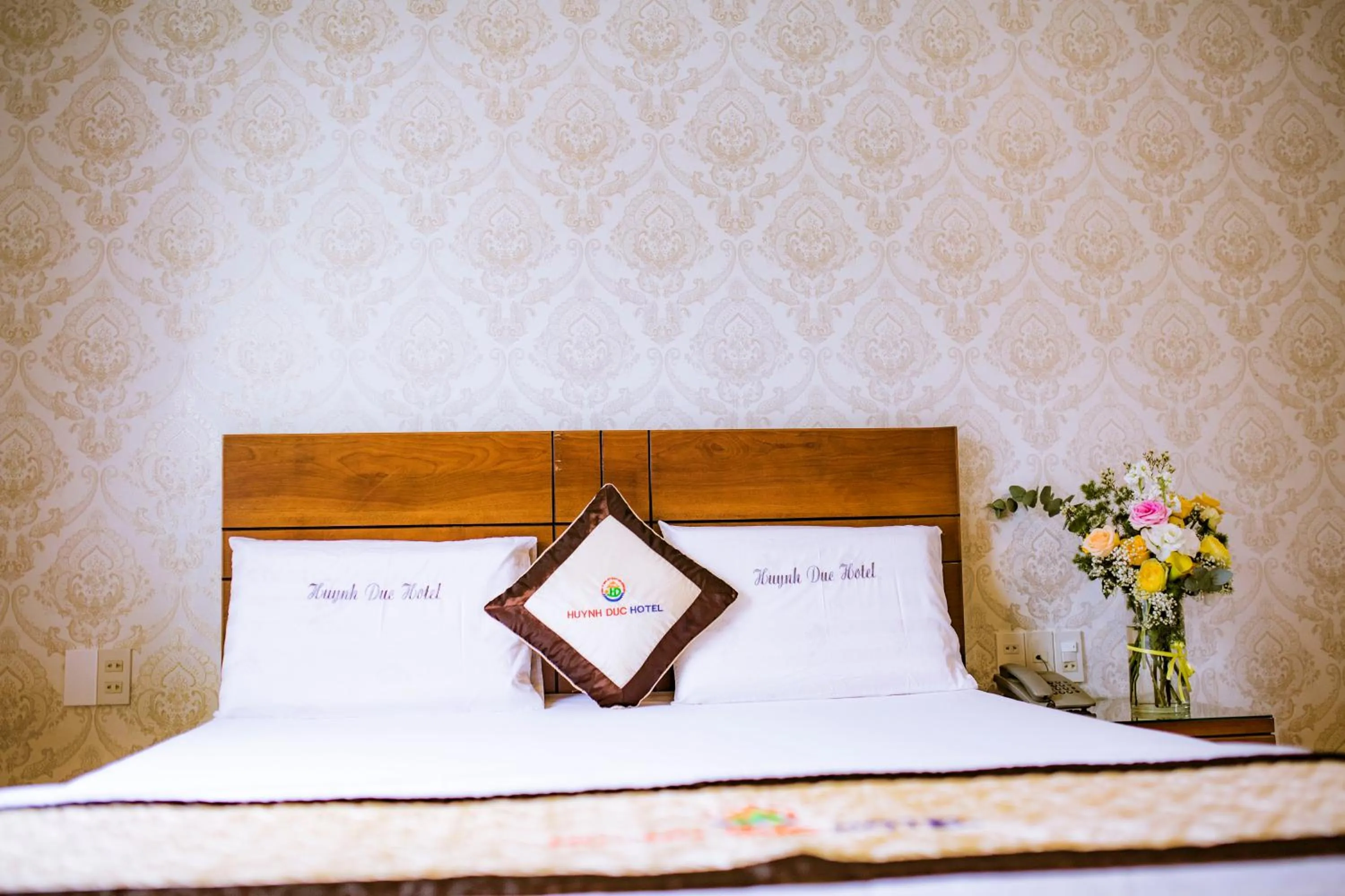 Bed in Huynh Duc Hotel