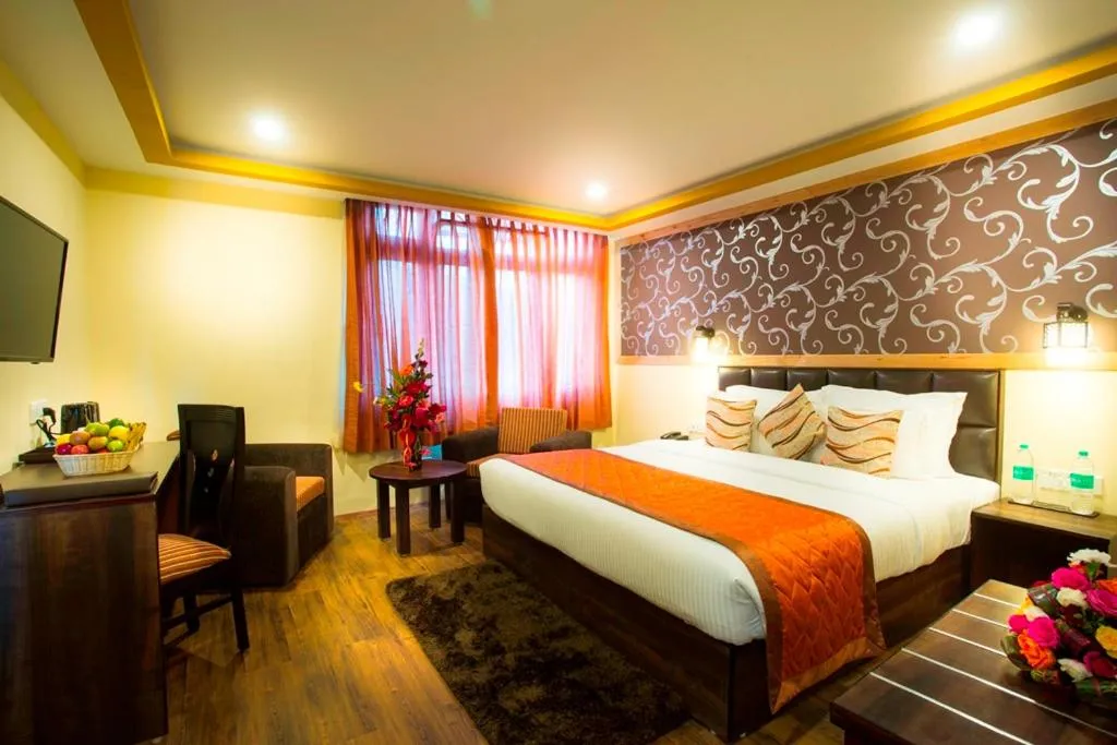 Photo of the whole room, Bed in New Orchid Lords Inn Gangtok