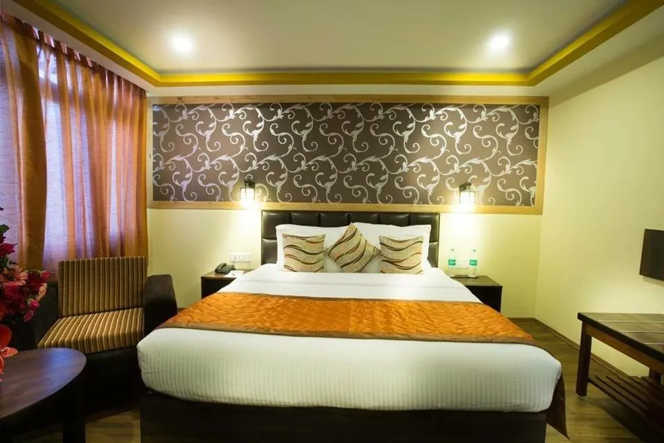 Photo of the whole room, Bed in New Orchid Lords Inn Gangtok