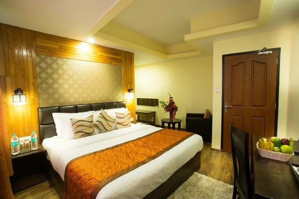 Photo of the whole room, Bed in New Orchid Lords Inn Gangtok