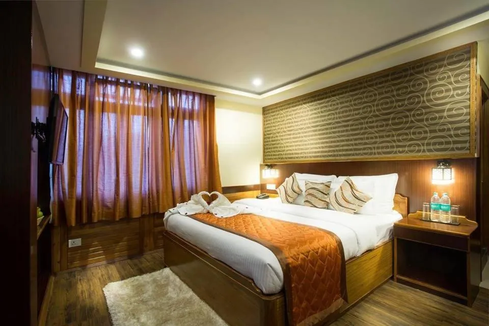 Photo of the whole room, Bed in New Orchid Lords Inn Gangtok