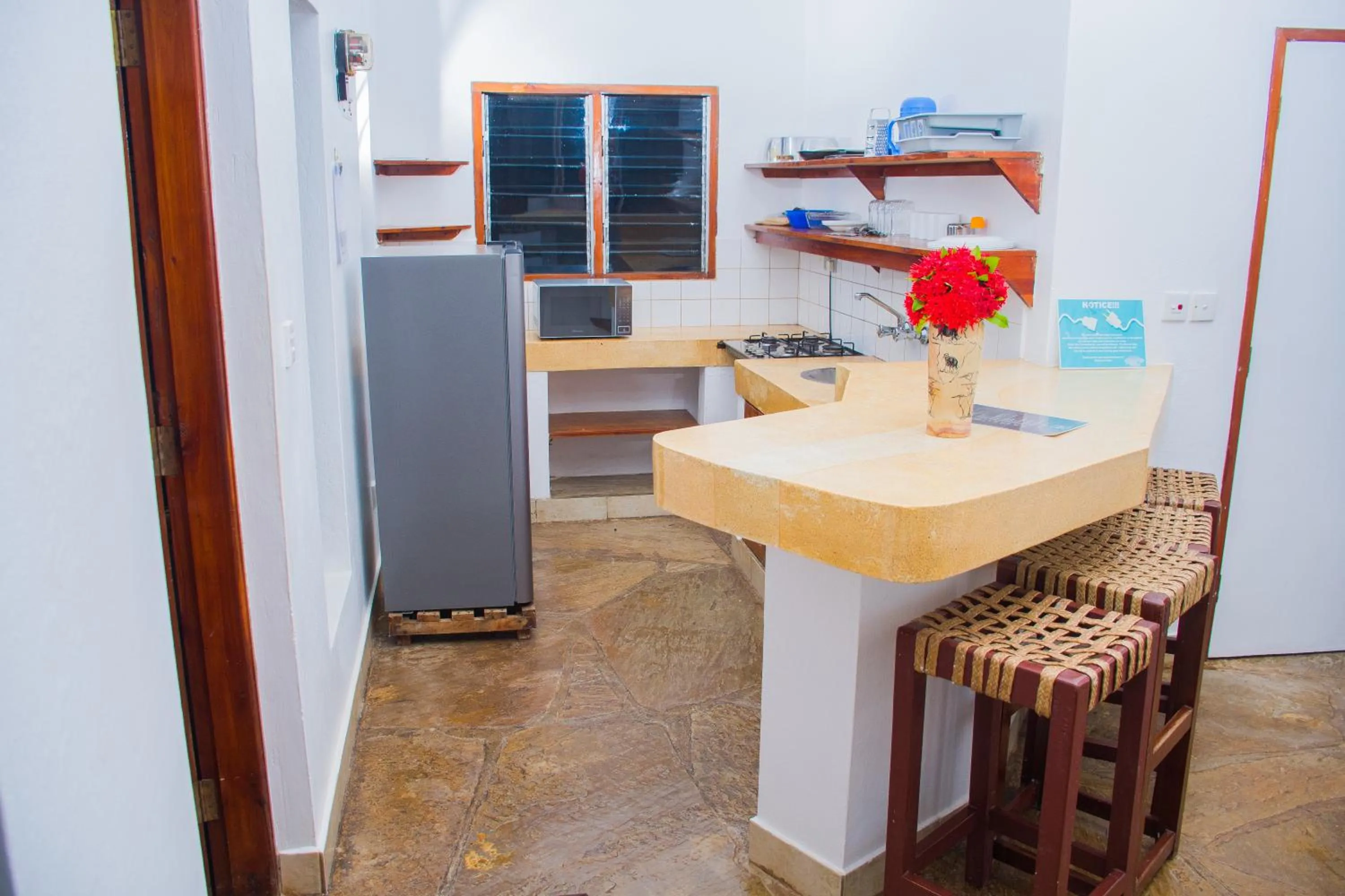 Kitchen or kitchenette in Doric Cottages Diani