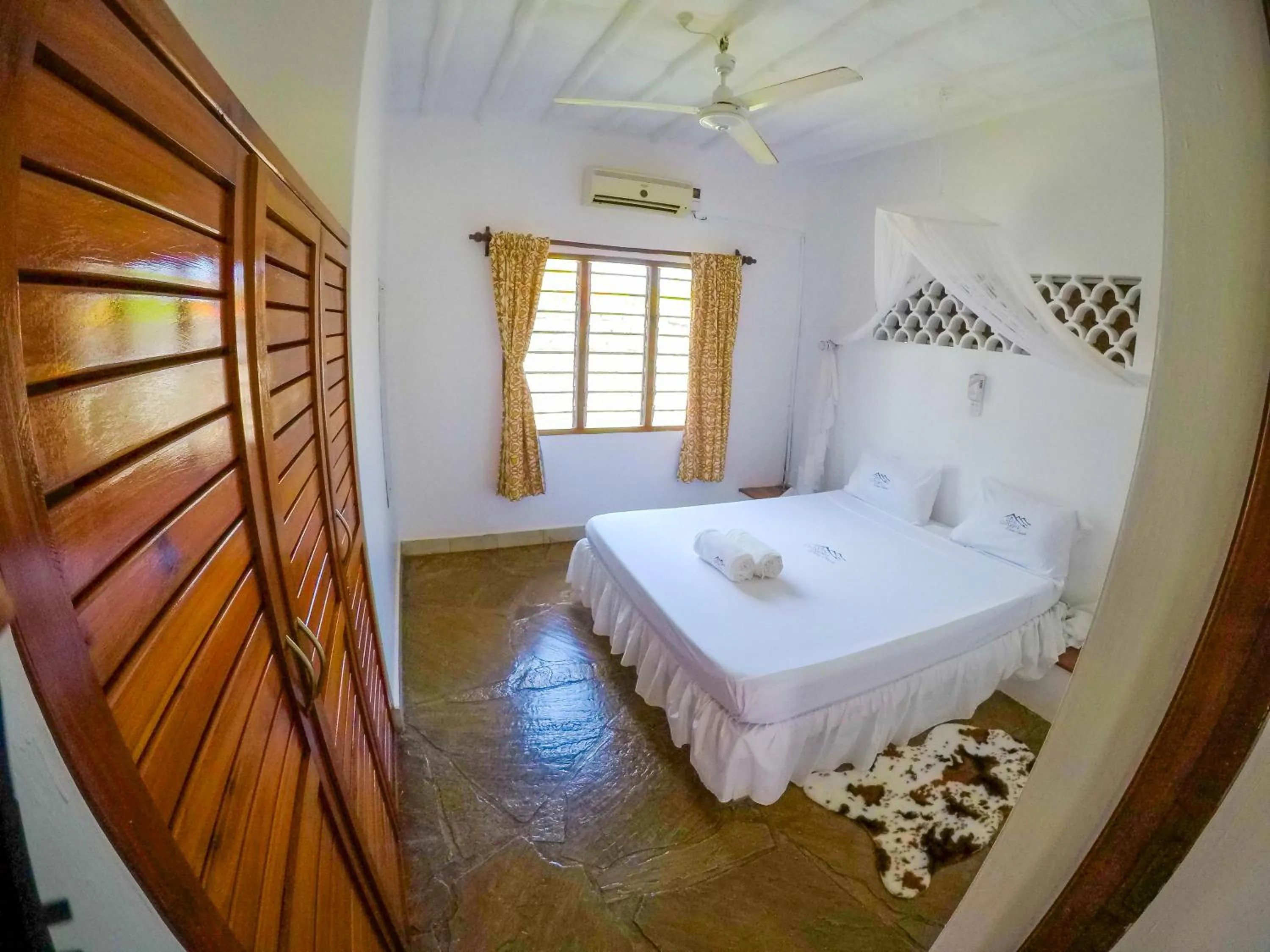 Bed in Doric Cottages Diani