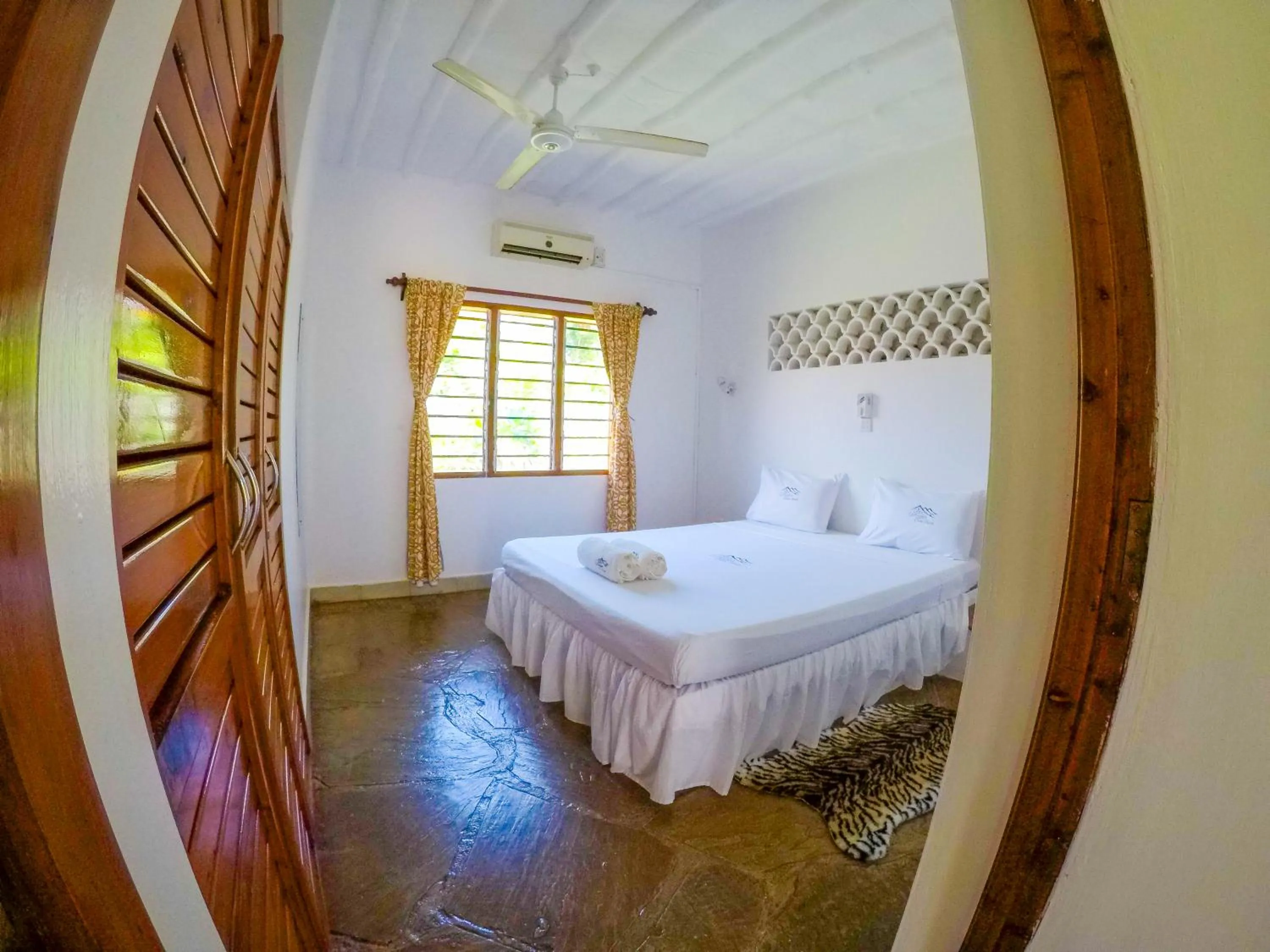 Bed in Doric Cottages Diani