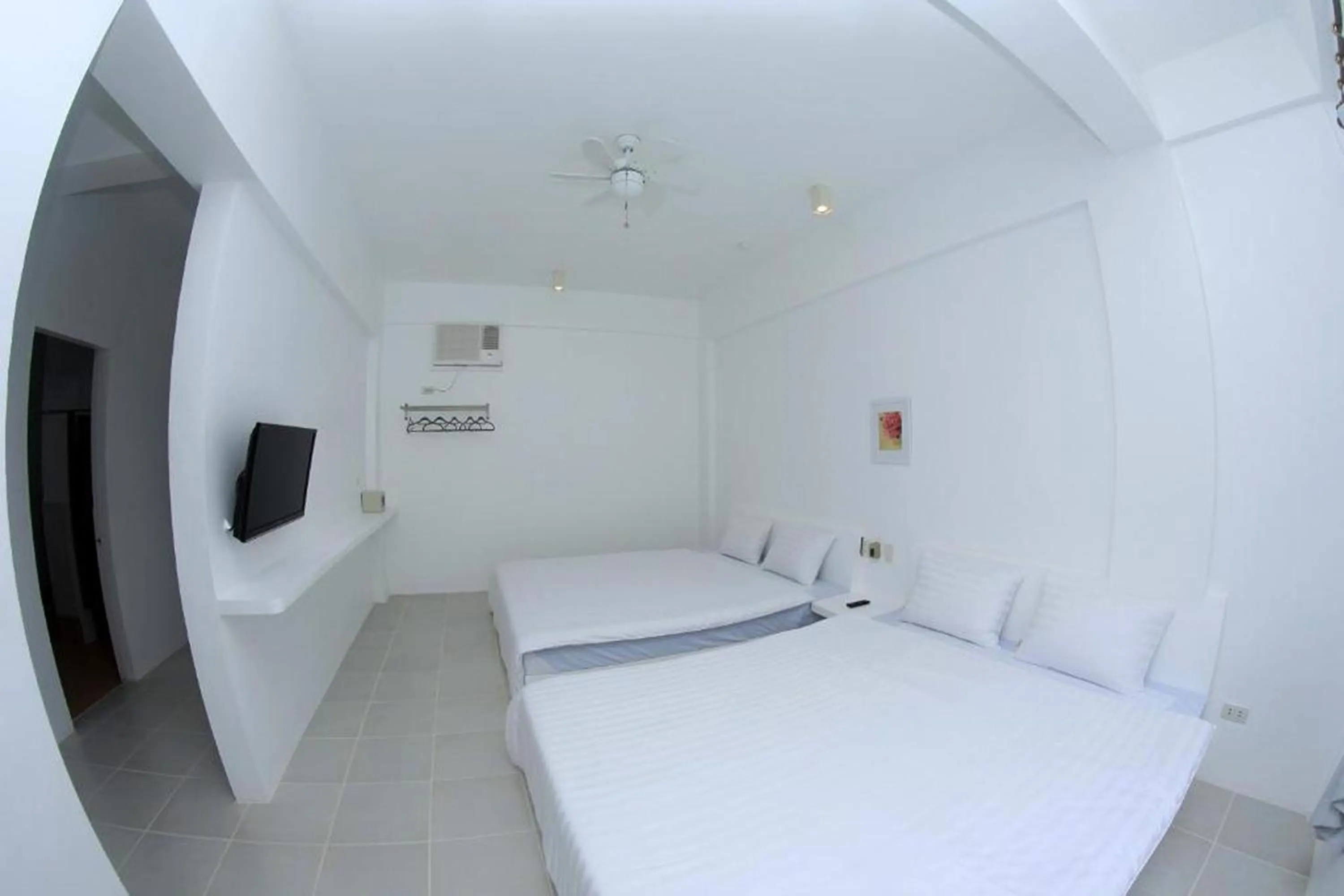 Photo of the whole room, Bed in Coron Bluewave Hotel