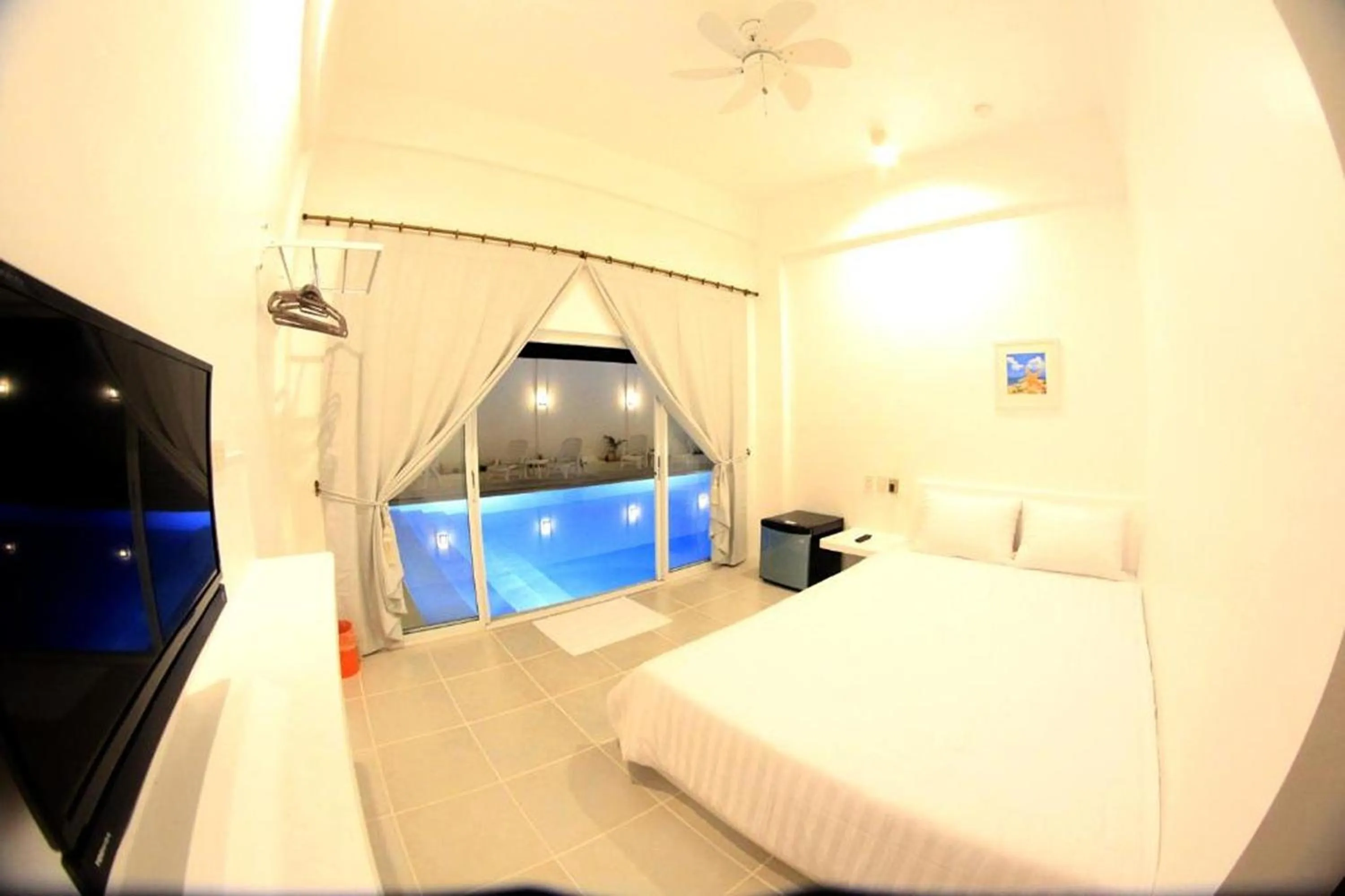 Photo of the whole room, Bed in Coron Bluewave Hotel