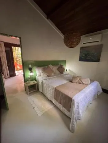 Bed in Pousada Bromélias