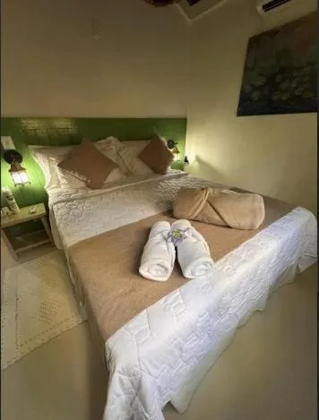 Bed in Pousada Bromélias