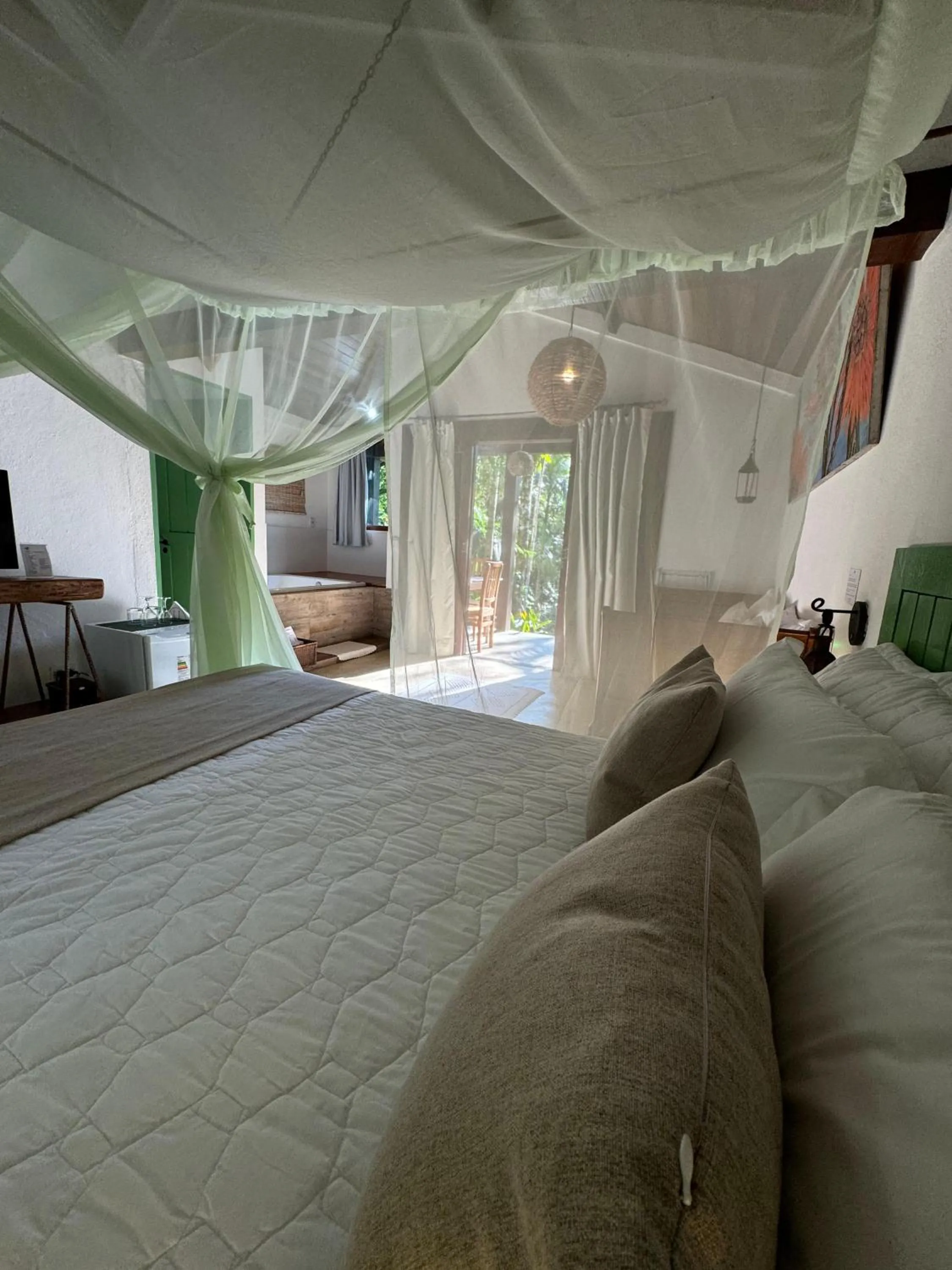 Bed in Pousada Bromélias