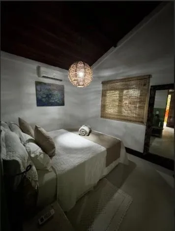 Bed in Pousada Bromélias