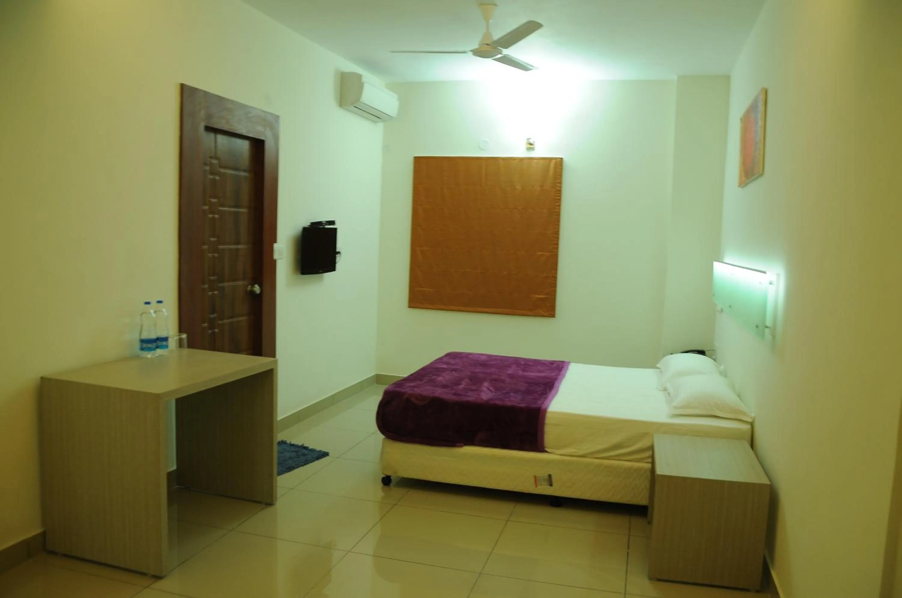 Bedroom in Cinnamon Residency