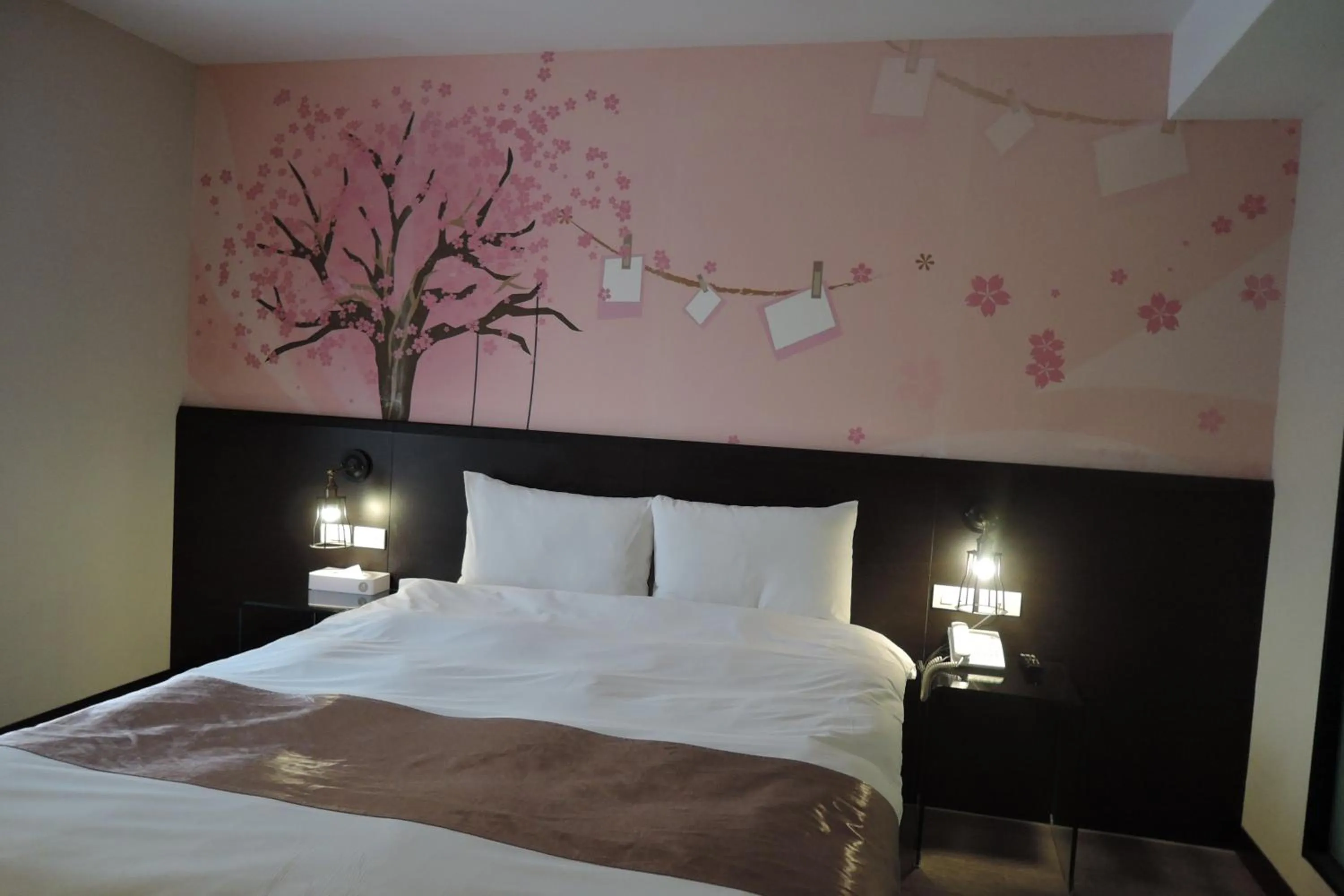 Bed in Travel Art Inn