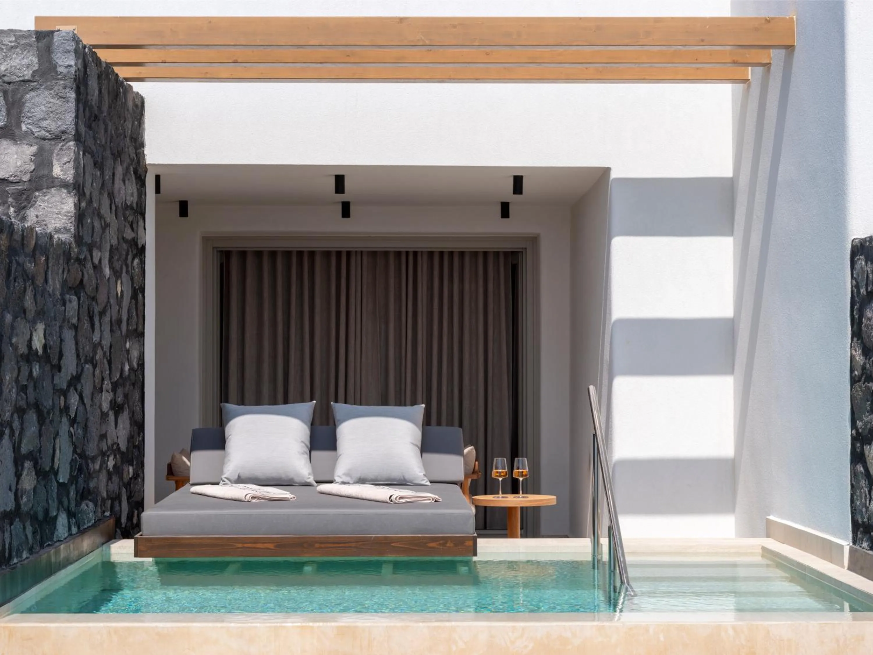 Pool view, Bed in Santo Pure Oia Suites & Villas