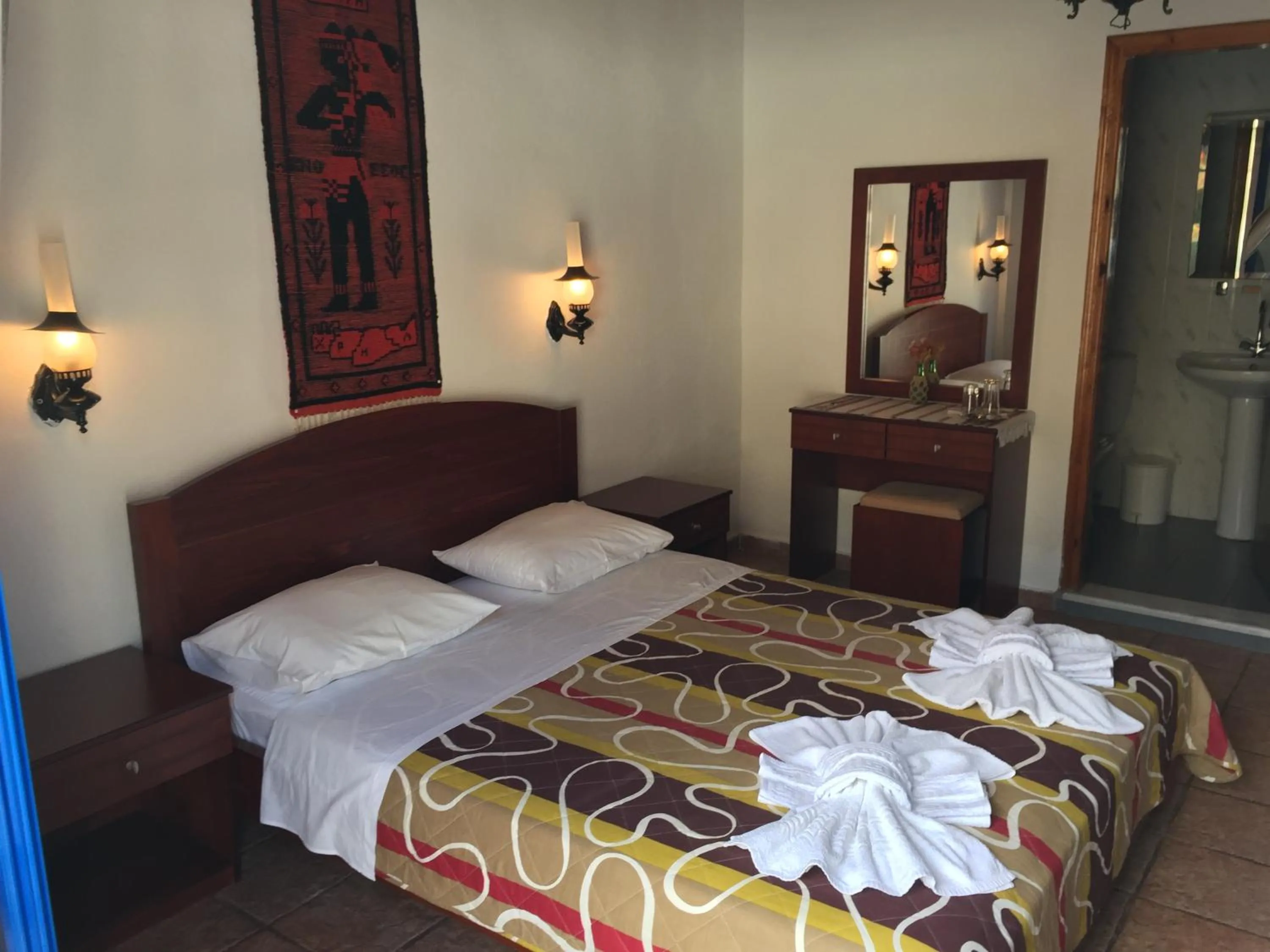 Bed in Daskalogiannis Hotel