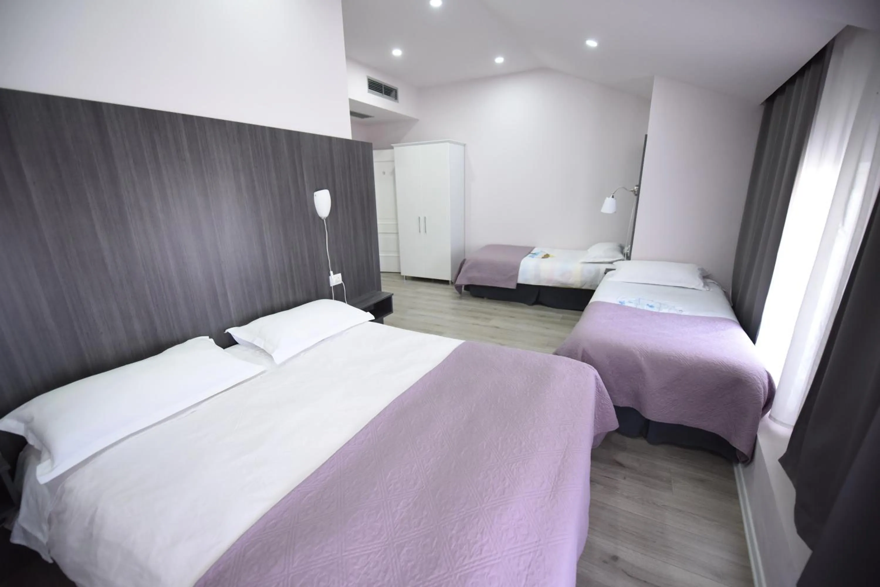 Bedroom, Bed in Rose Garden Hotel