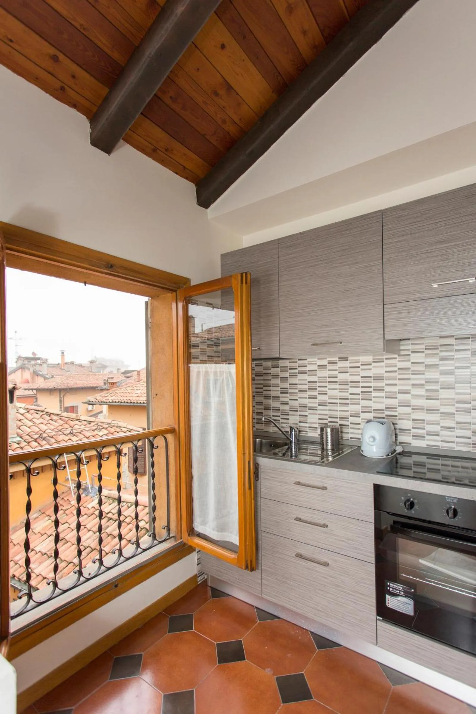 Kitchen or kitchenette in Residenza Ariosto Depandance by Studio Vita