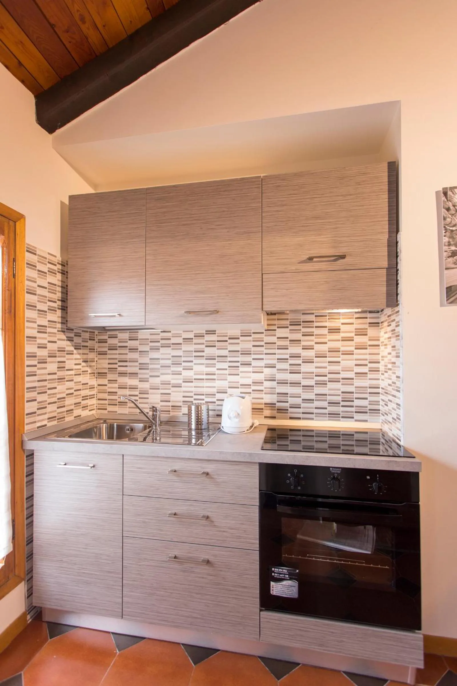 Kitchen or kitchenette in Residenza Ariosto Depandance by Studio Vita