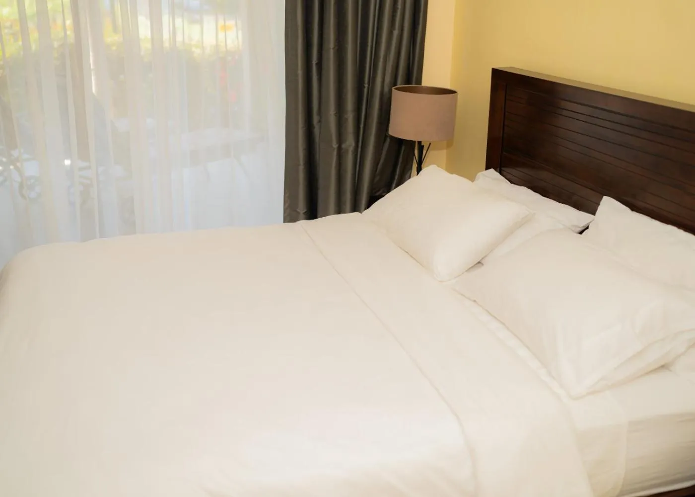 Bed in De Wingerd Wijnland Lodge