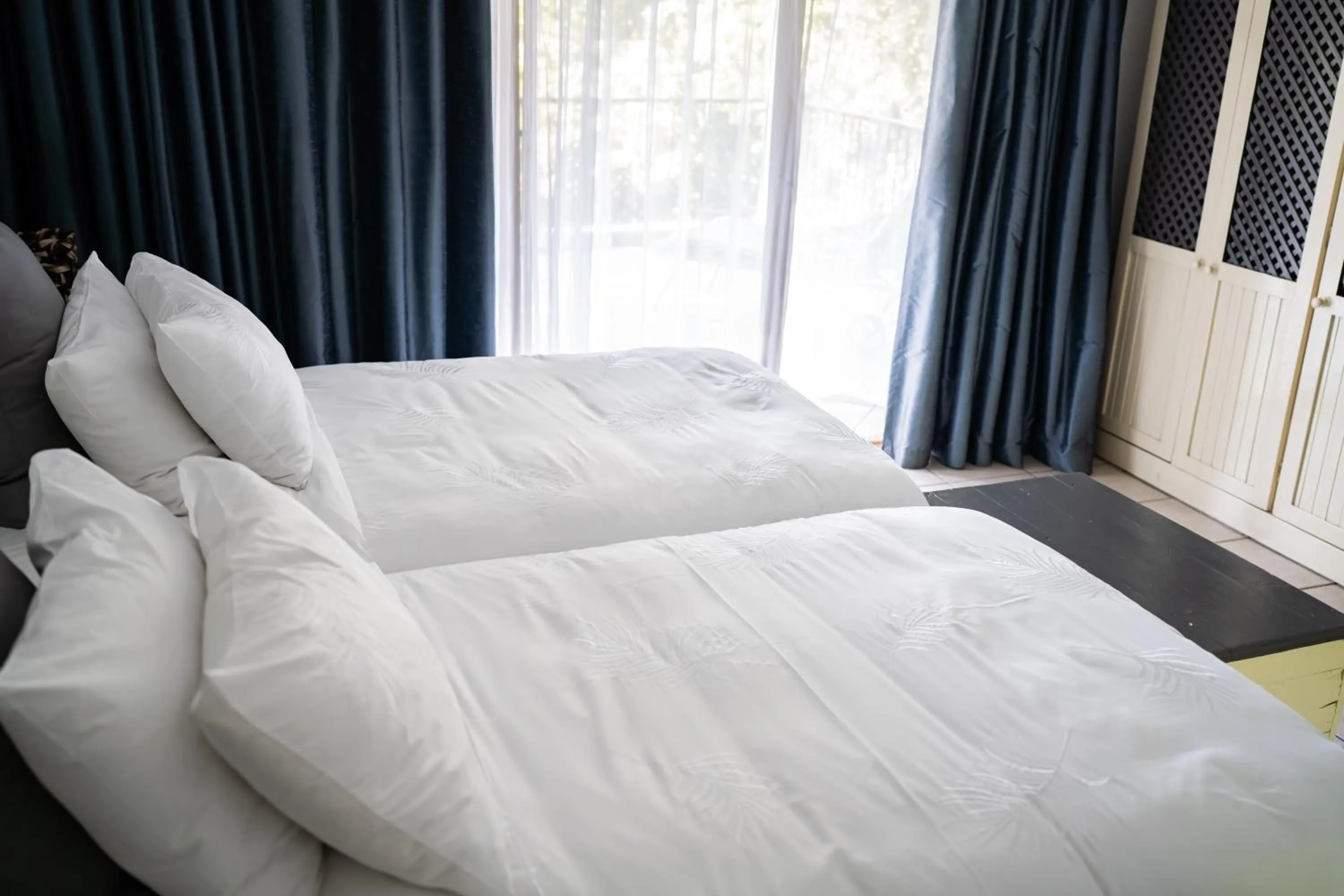 Bed in De Wingerd Wijnland Lodge